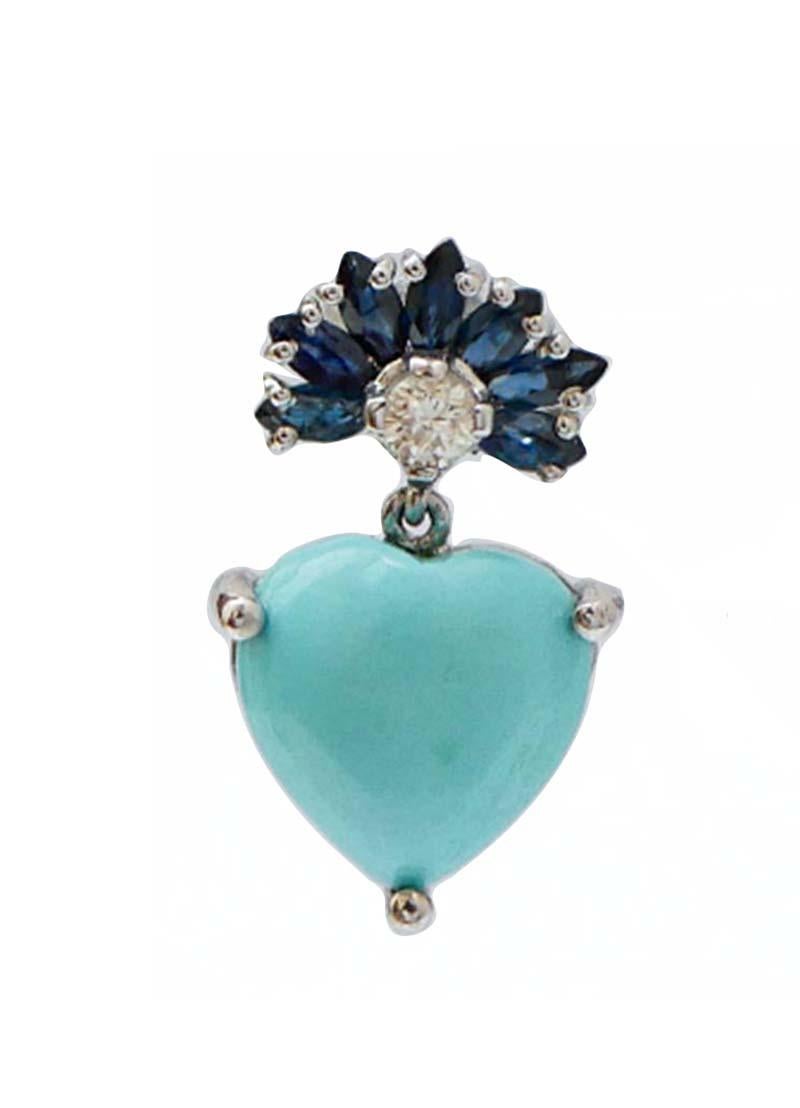 Orecchini fashion con struttura in oro bianco 14 kt montata con zaffiri e un diamante nella parte superiore. Come ciondolo, un cuore turchese.
Diamanti 0.19 ct
Zaffiri 1.18 ct
Turchese 1.20 gr
Peso totale 3.80 gr
RF  ++GHGA

Per qualsiasi