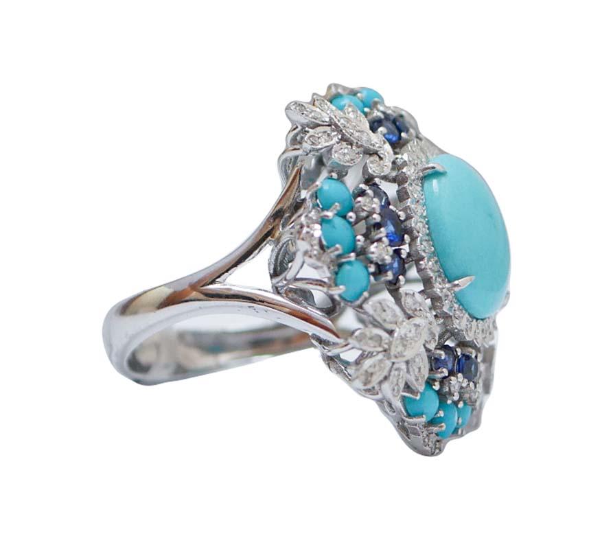 Amazing ring in 14 kt white gold structure mounted with a central turquoise surrounded by diamonds, sapphires and little turquoises.
This ring was totally handmade by Italian master goldsmiths and it is in perfect conditions.
Diamonds 0.68