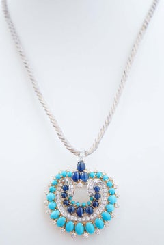 Turquoise, Sapphires, Diamonds, 18 Kt White Gold and Yellow Gold Brooch.