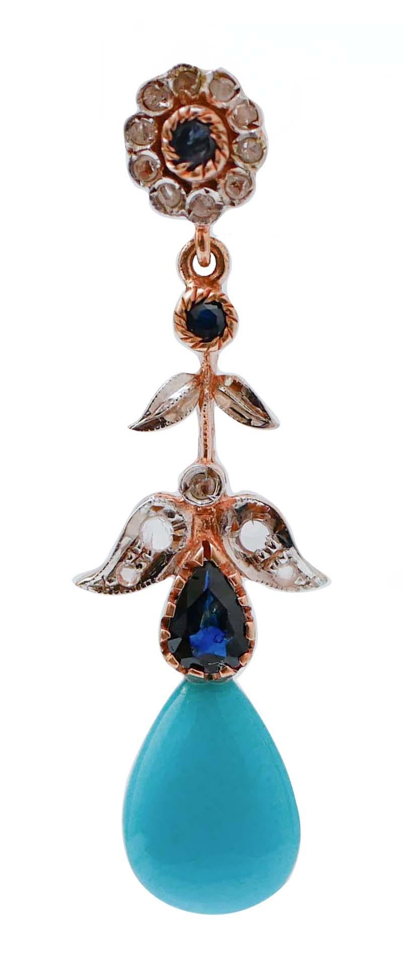 Amazing earrings in 9 kt rose gold and silver structure mounted with a flower of diamonds and a central sapphire  in the upper part; in the middle, sapphires and leaves studded with diamonds. Below, a turquoise.
Diamonds 0.29 ct
Sapphires  1.25