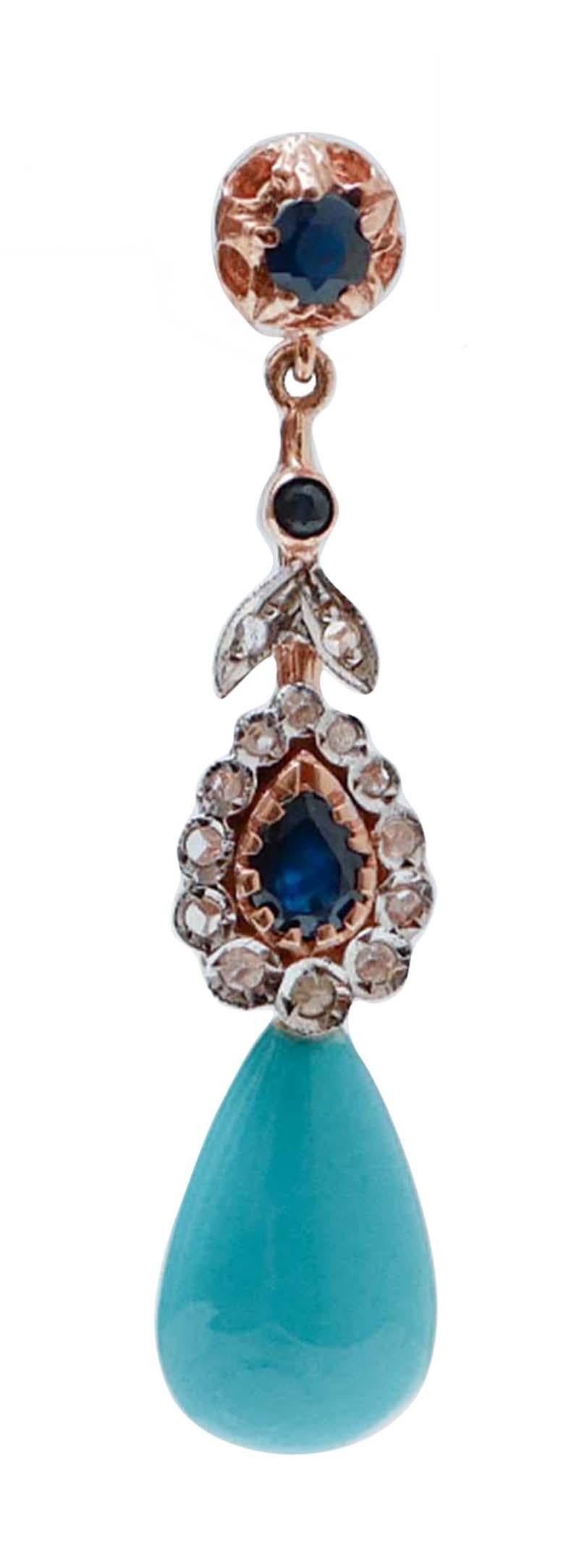 Dangle earrings in 9 kt rose gold and silver structure mounted with diamonds and sapphires along the length of the earring and a drop turquoise as pendant.
Diamonds 0.20 ct
Sapphires 1.58 ct
Turquoise 2.30 gr 
Total Weight 6.90 gr
RF *GORA

For any