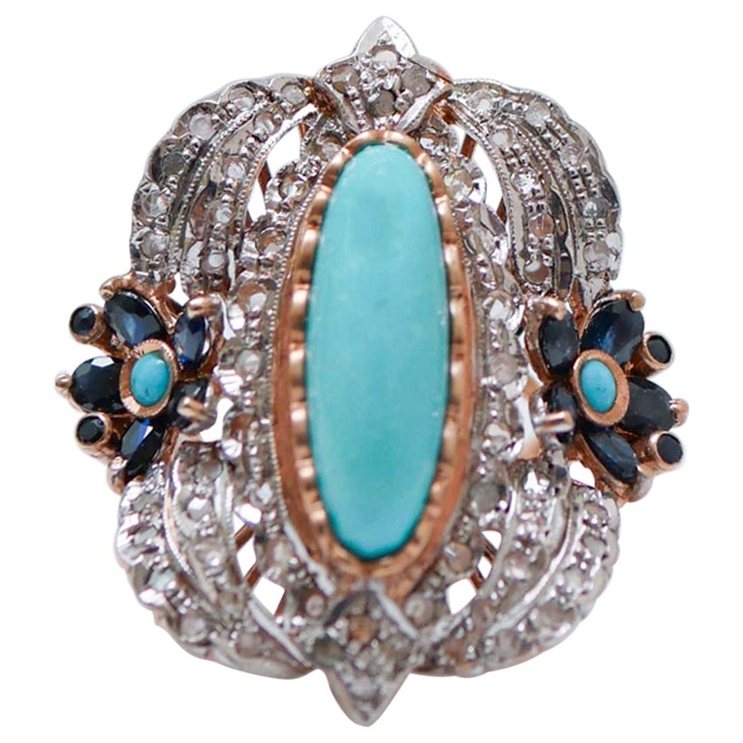 Anello con turchese, zaffiri, diamanti, oro rosa e argento.