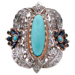 Anello con turchese, zaffiri, diamanti, oro rosa e argento.