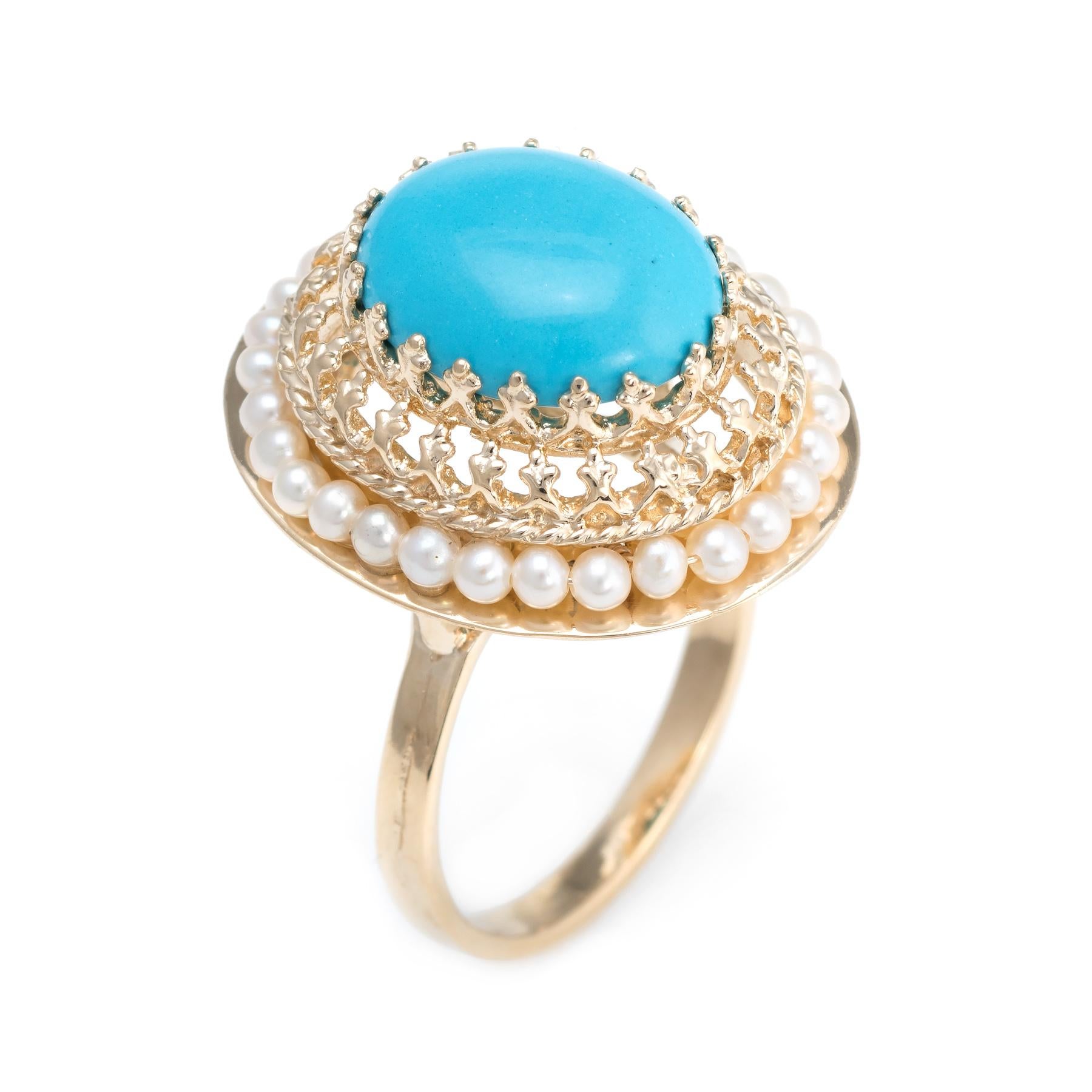 Finely detailed estate turquoise and seed pearl cocktail ring, crafted in 14 karat yellow gold. 

Cabochon cut turquoise measures 12mm x 10mm (estimated at 5 carats), accented with thirty 2mm seed pearls. The turquoise is in excellent condition and
