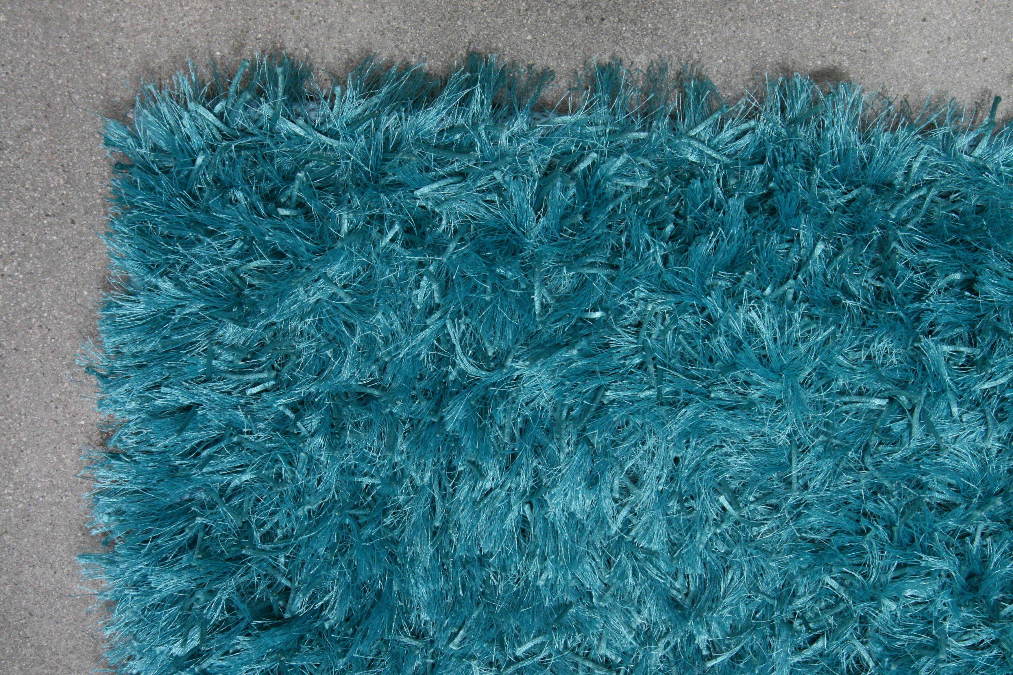 turquoise fluffy rug