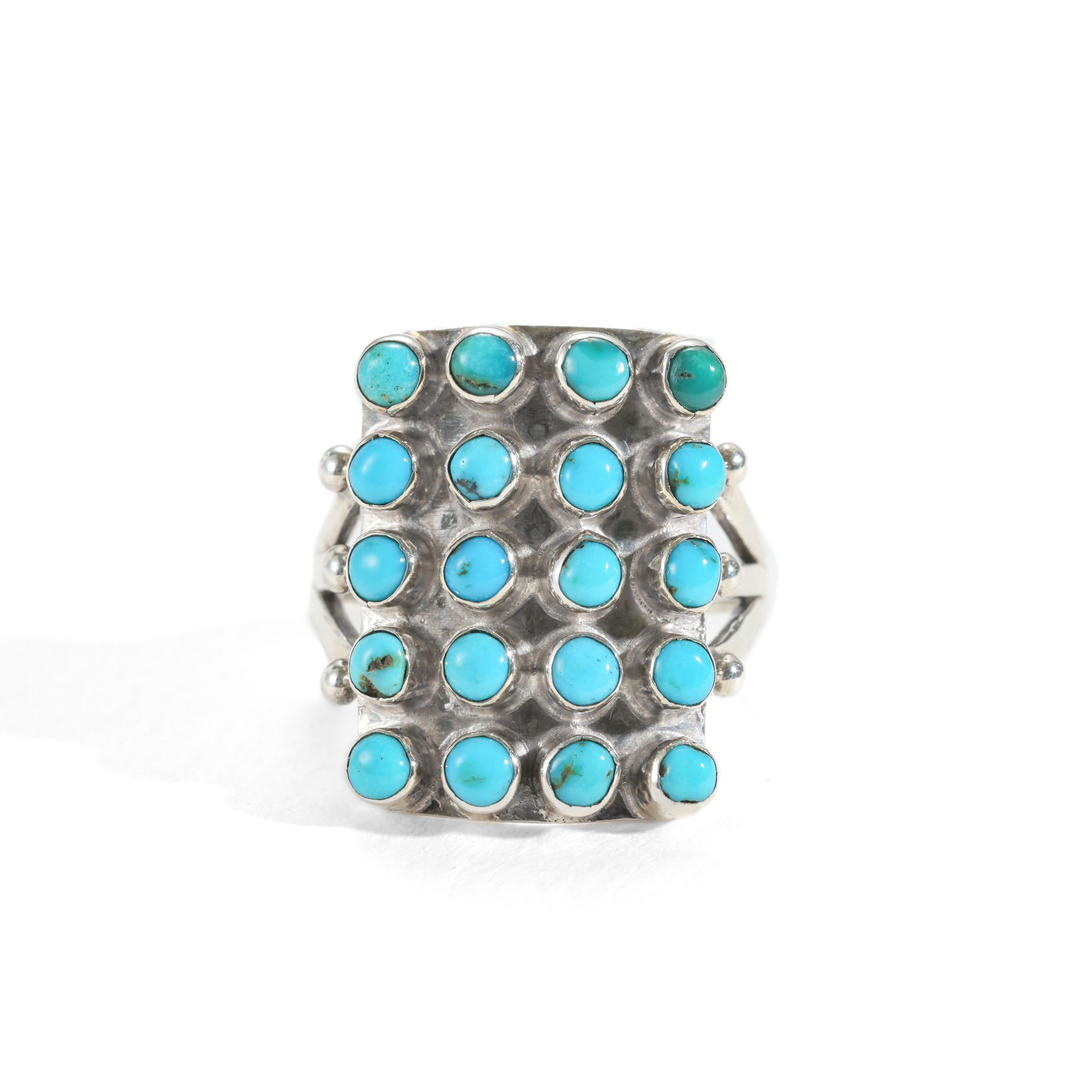 This sleek, graphic turquoise and silver ring was created near the 1920s, and is consistent in design, quality, and materials to rings created by the Zuni nation; however the ring is not signed. And therefore, it cannot be sold as 