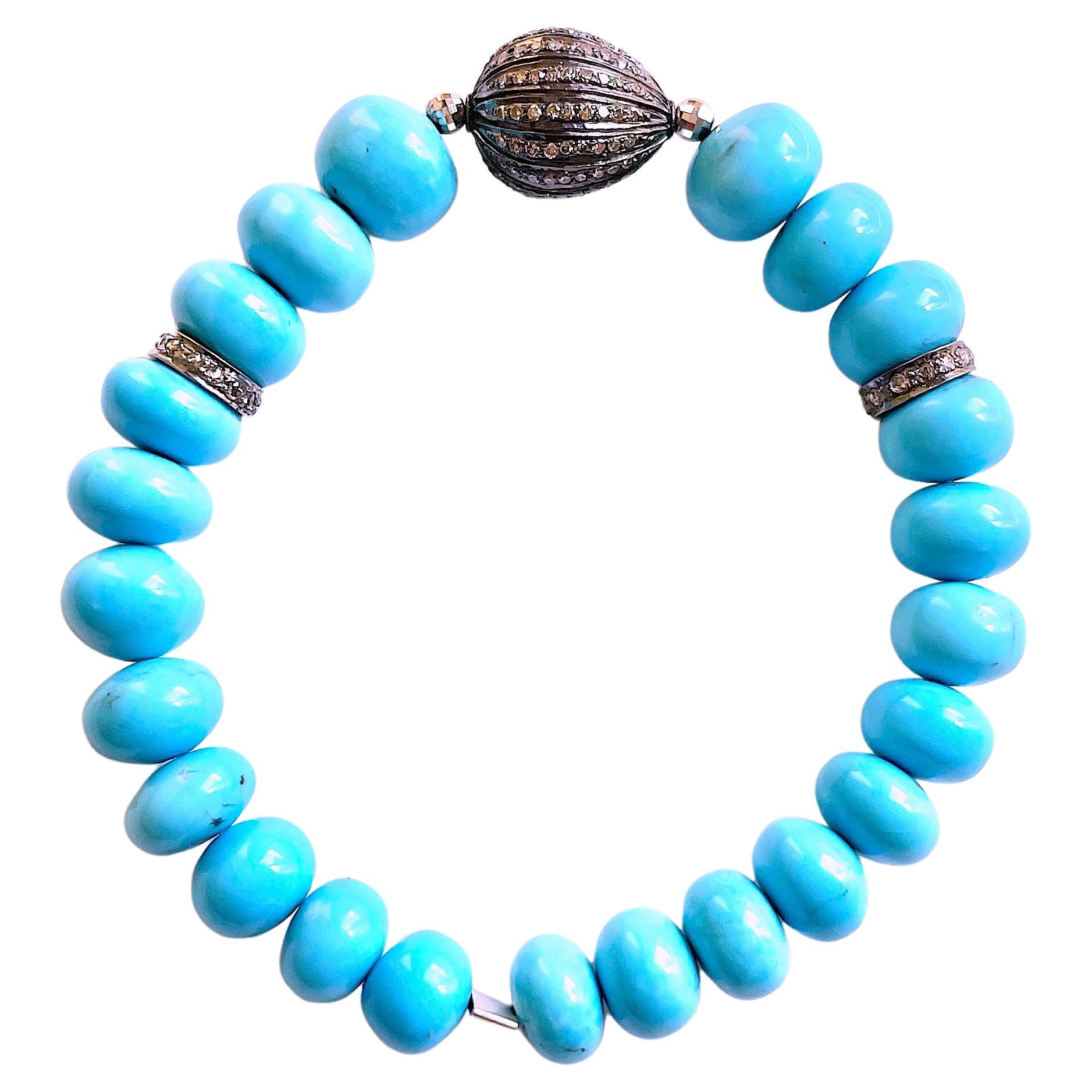 Description
Sleeping Beauty turquoise, pave diamonds, with 14k white gold faceted balls stretchy bracelet.
Item # B1262

Materials and Weight
Sleeping Beauty Turquoise 52 carats, 8 to 10mm, round beads.
Rhodium sterling silver 12mm ball, and