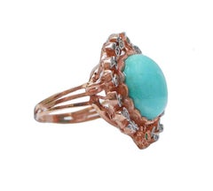 Anello con turchese, spinello, diamanti, oro rosa e argento.