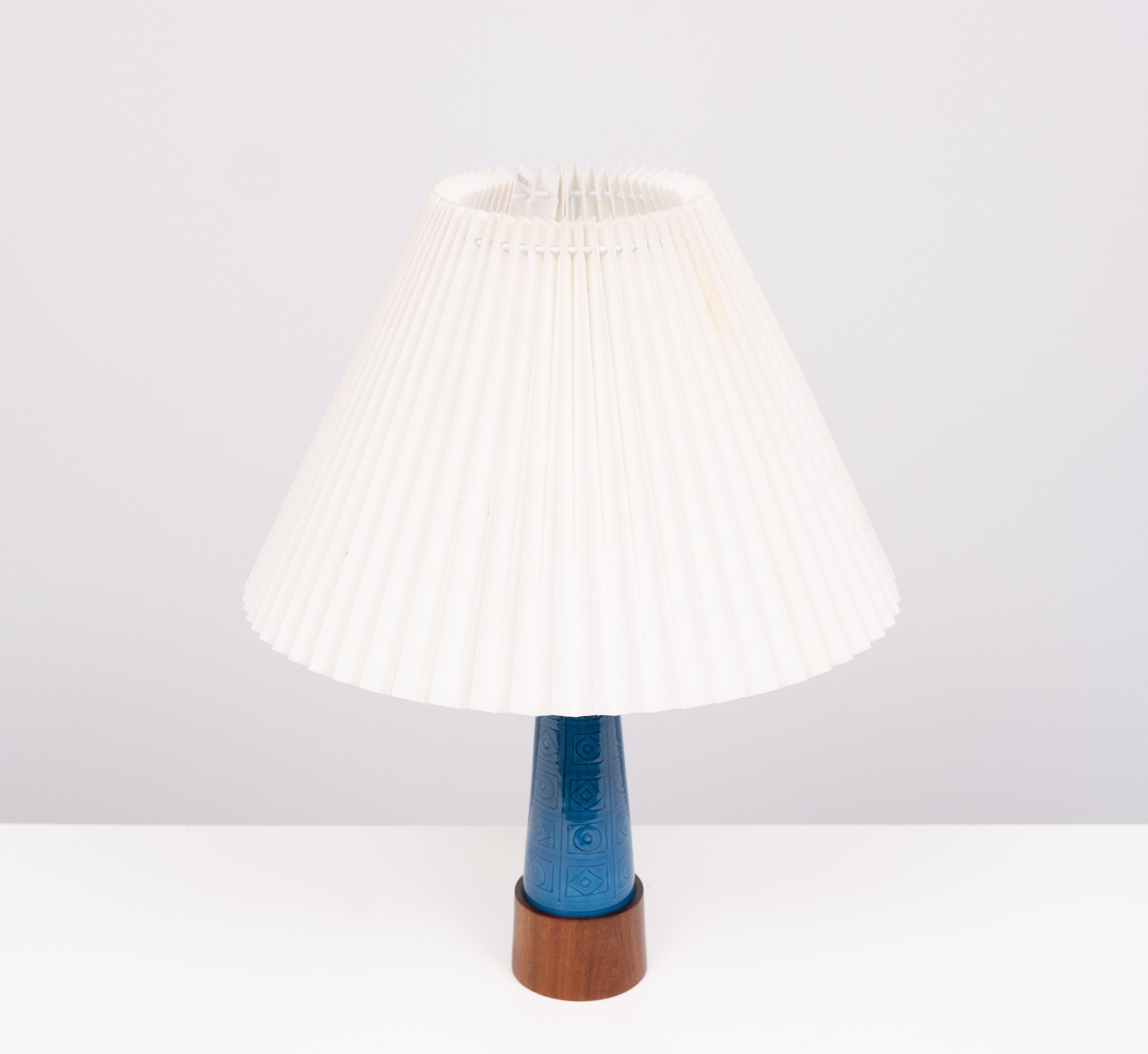Very nice attractive Turquoise Stoneware Table lamp. comes with 
a Teak base . Beautiful Scandinavian design .