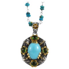 Ciondolo con tormalina turchese e diamante in oro 18 carati e argento