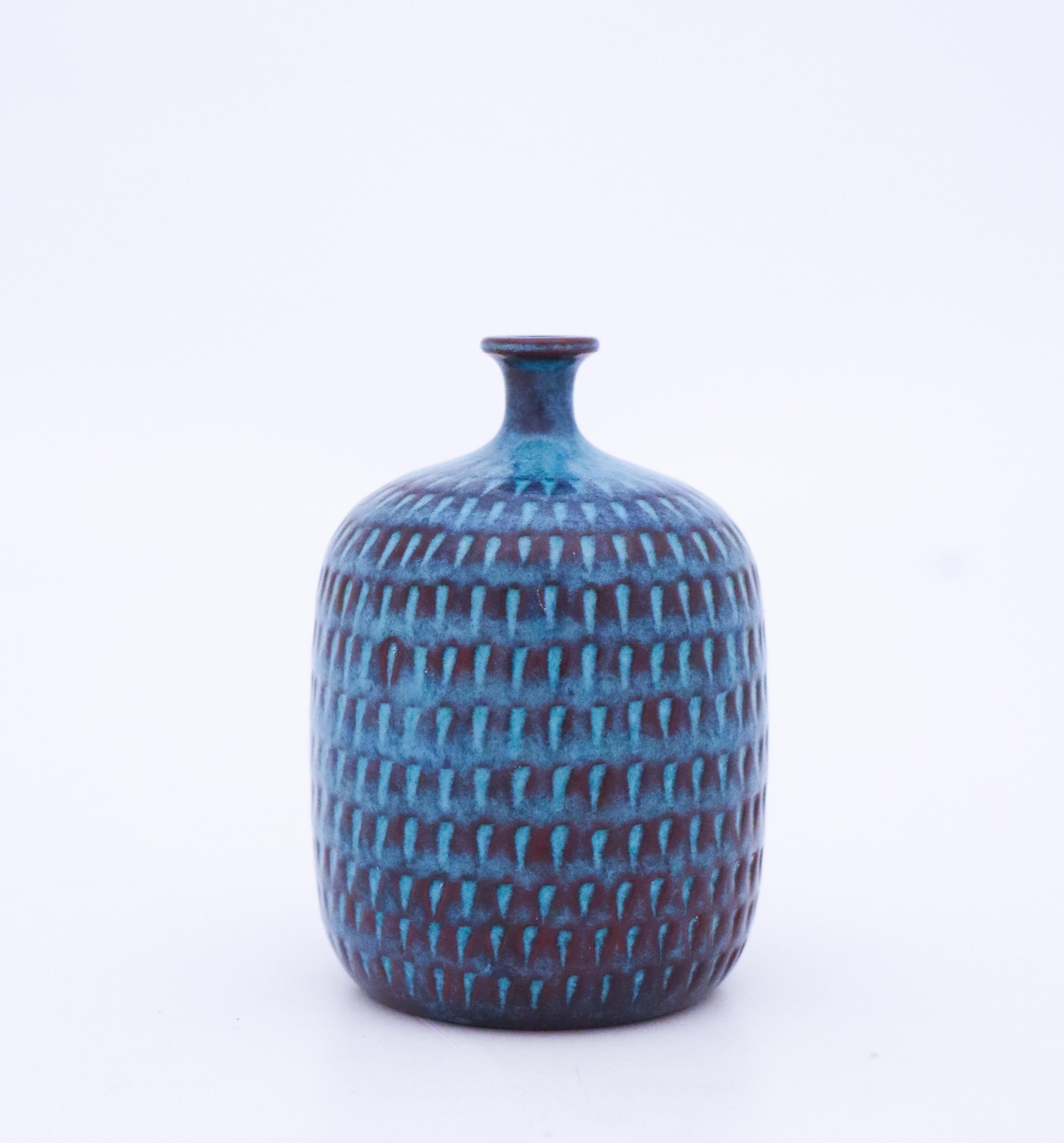 A turquoise vase designed by Stig Lindberg at Gustavsberg. It is 8.5 cm high and in very good condition.