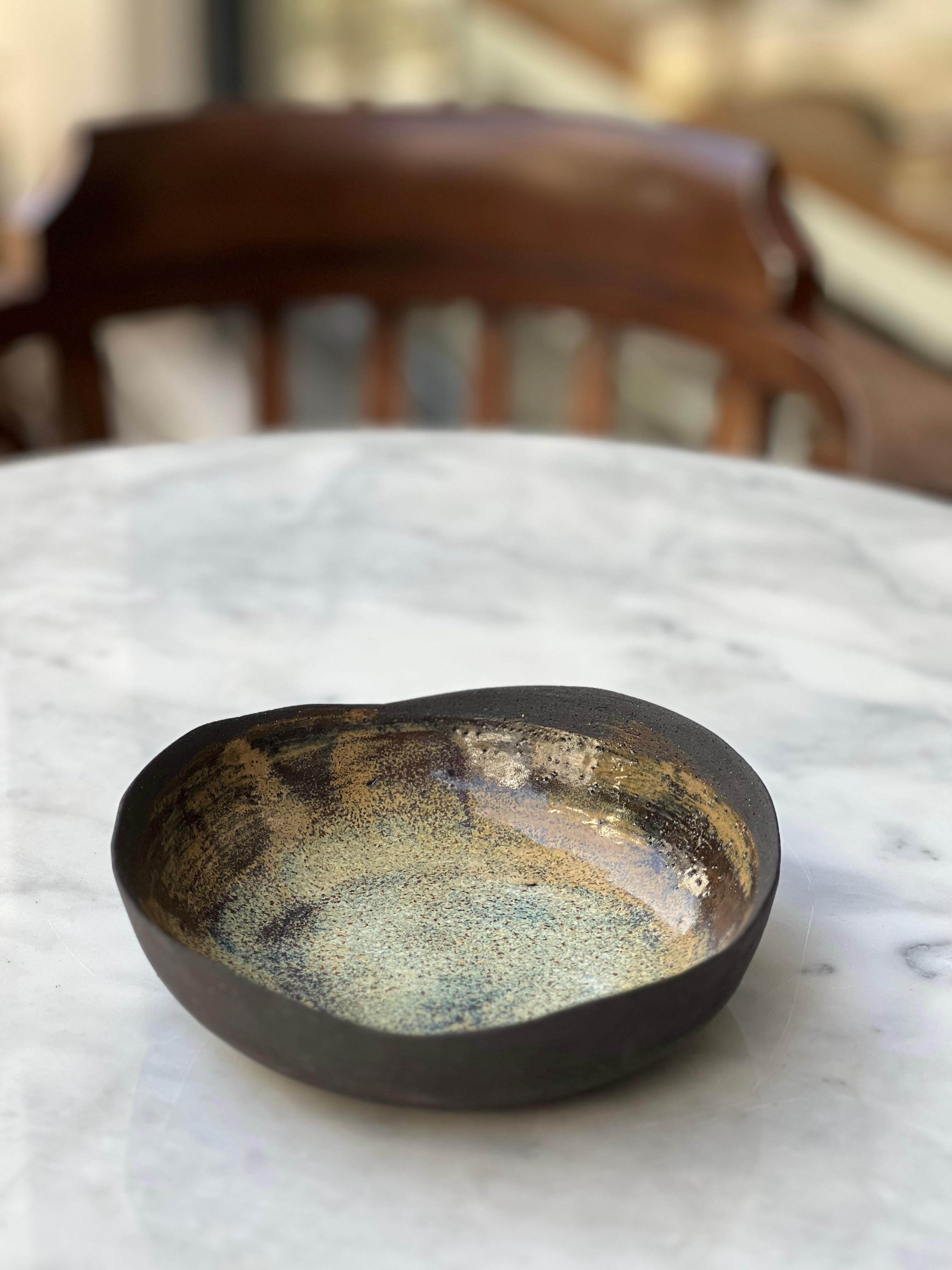 Turquoise Wave Plate by Güler Elçi
Dimensions: D 16 x H 3.8 cm
Materials: Stoneware Ceramic, Food Safe Glaze.

Güler Elçi is a ceramic artist based in Istanbul. In the light of her engineering career, she considers ceramics as a material and likes