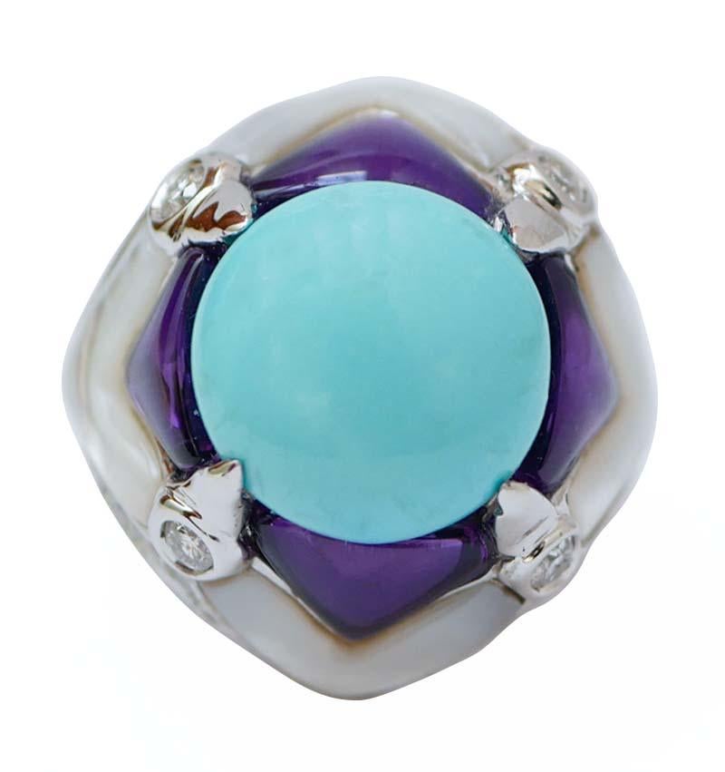 Fantastic ring in 14 kt white gold structure mounted with a central turquoise surrounded by amethysts, white stones and diamonds.
This ring was totally handmade by Italian master goldsmiths  and it is in perfect conditions.
Diamonds 1.93