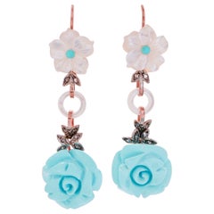 Orecchini in turchese, pietre bianche, diamanti, oro rosa e argento.