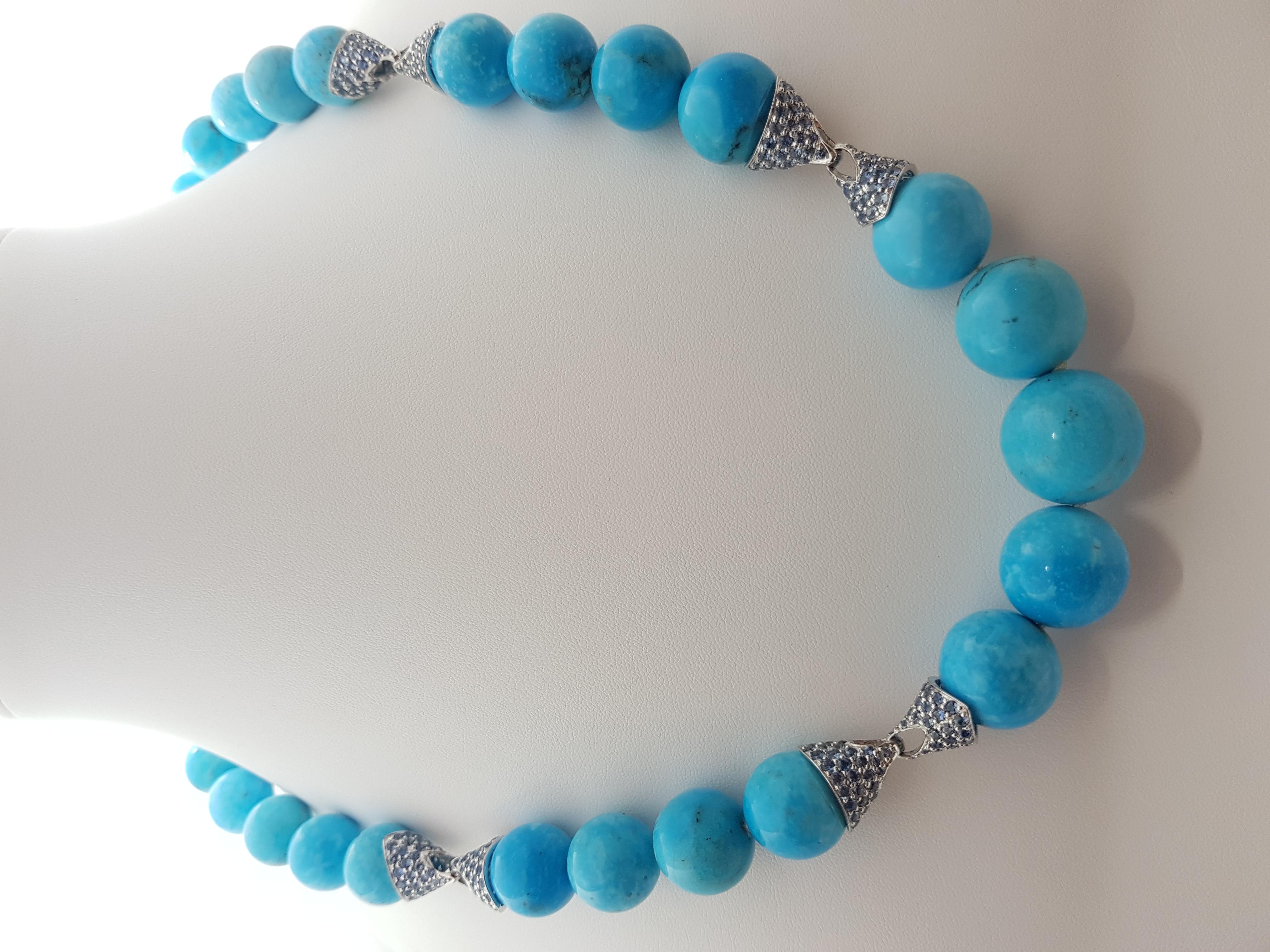 Turquoise with Blue Sapphire 15.13 carats Necklace set in Silver Settings

Width: 1.7  cm 
Length:  58.0 cm
Total Weight: 153.1 grams

*Please note that the silver setting is plated with rhodium to promote shine and help prevent oxidation.  However,