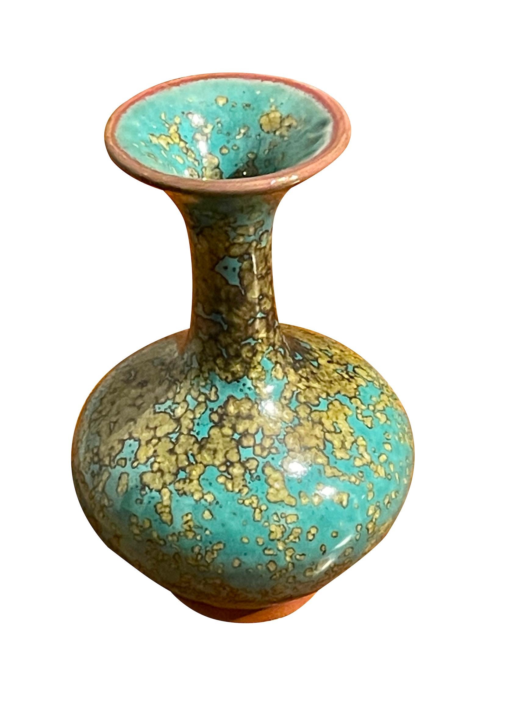 Contemporary Chinese turquoise with gold speckled glaze vase.
Classic shape with wide spout opening.
One of several pieces from a large collection.