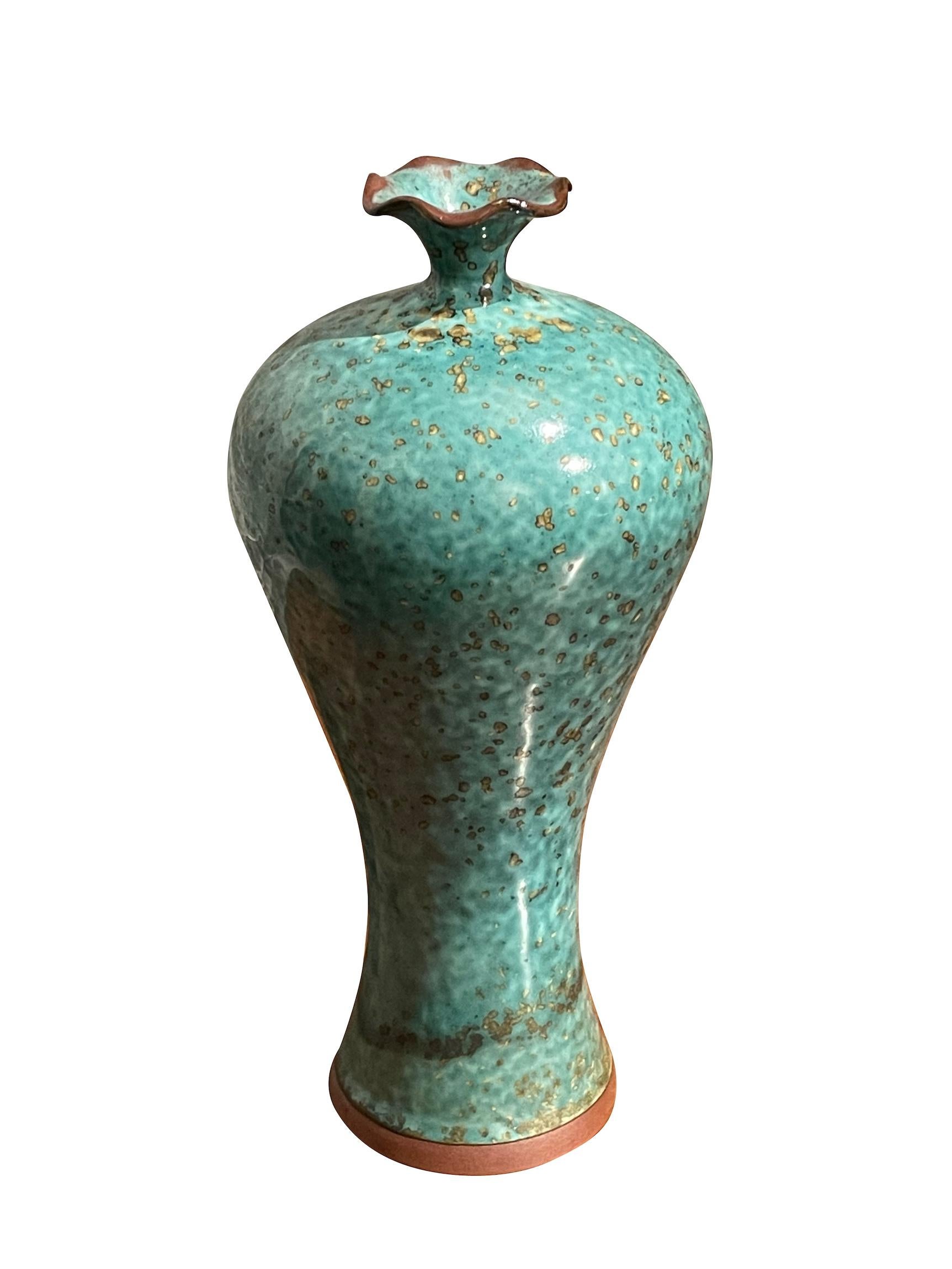 Contemporary Chinese turquoise with gold speckled glaze vase.
Classic shape with scalloped design spout opening.
Two available and sold individually.
One of several pieces from a large collection.
ARRIVING MARCH