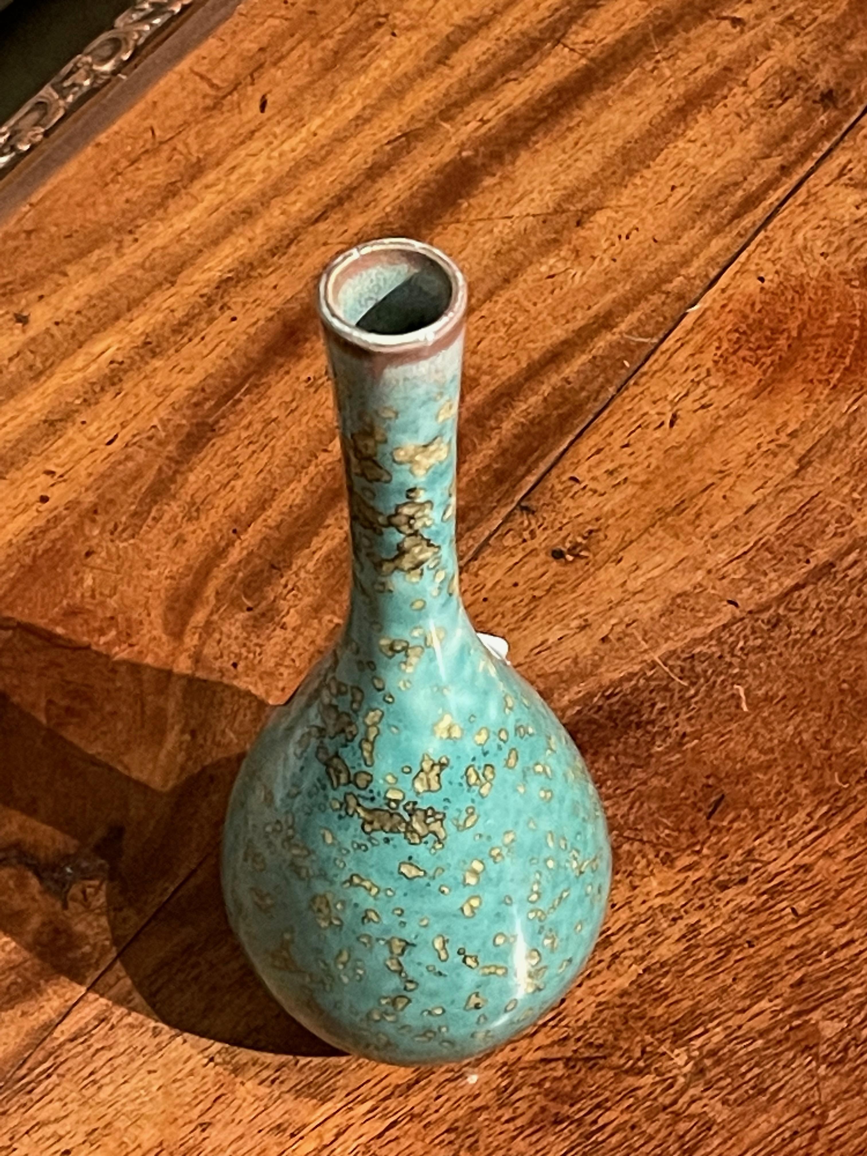 Contemporary Chinese turquoise with gold speckled glaze vase.
Thin with small spout.
One of several pieces from a large collection.