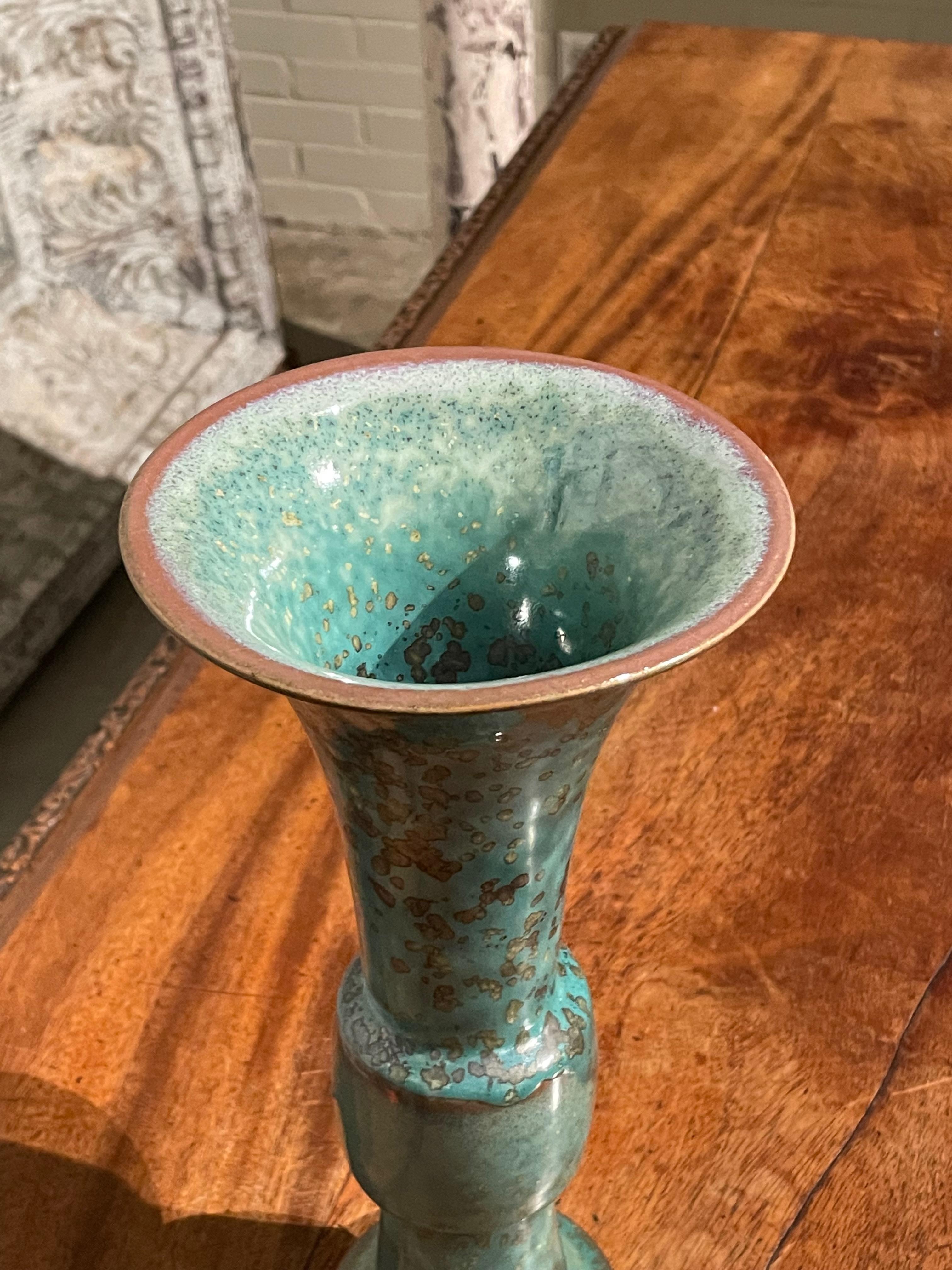 Contemporary Chinese turquoise with gold speckled glaze vase.
Classic tall shape with wide band.
One of several pieces from a large collection.