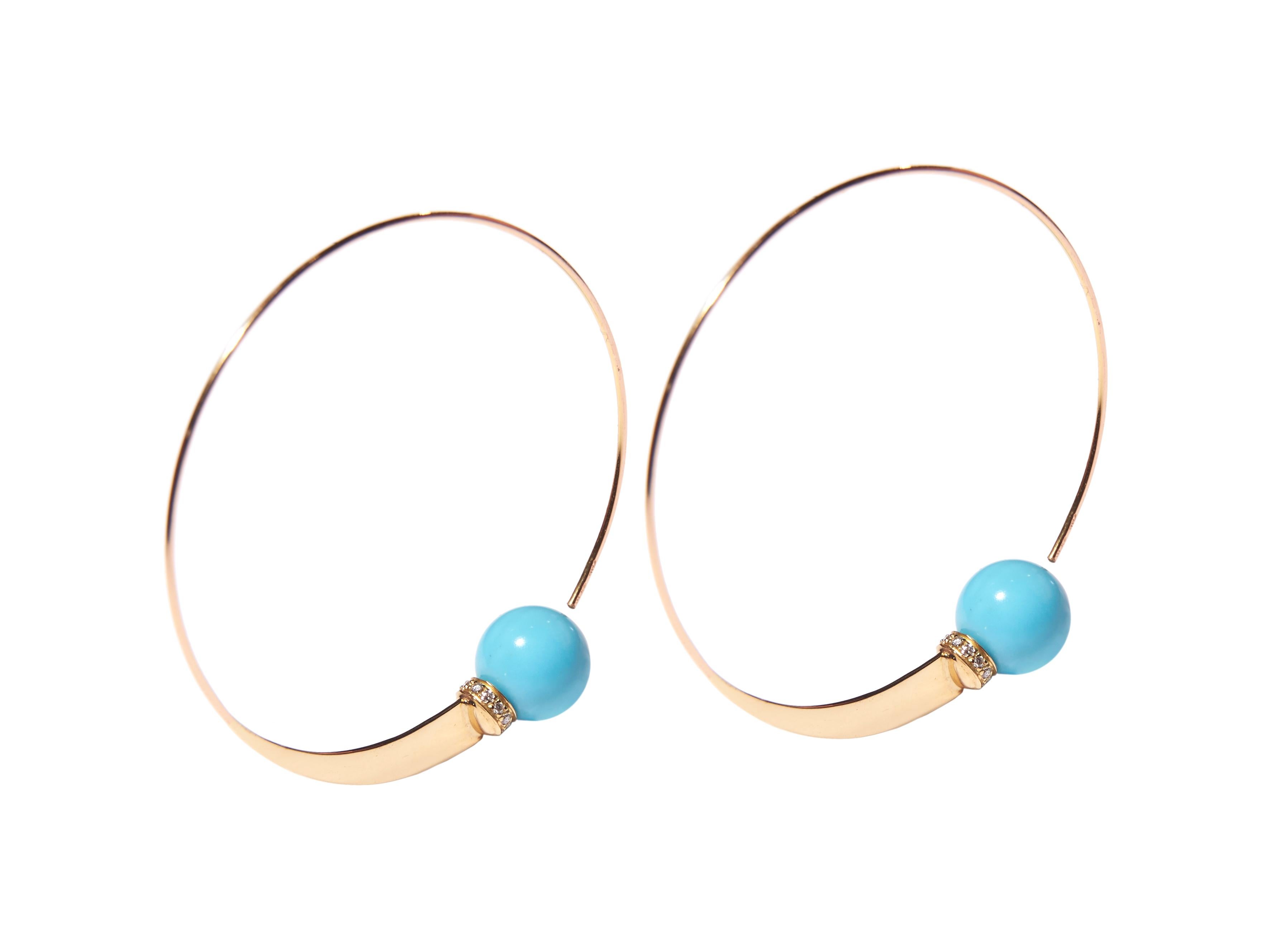 These 18 karat yellow gold hoop pull-through hoop earrings feature a natural turquoise bead with a diamond detail, the little something that shows you are cool enough to be subtle yet stylish enough to be just out of the ordinary. 
The diameter of