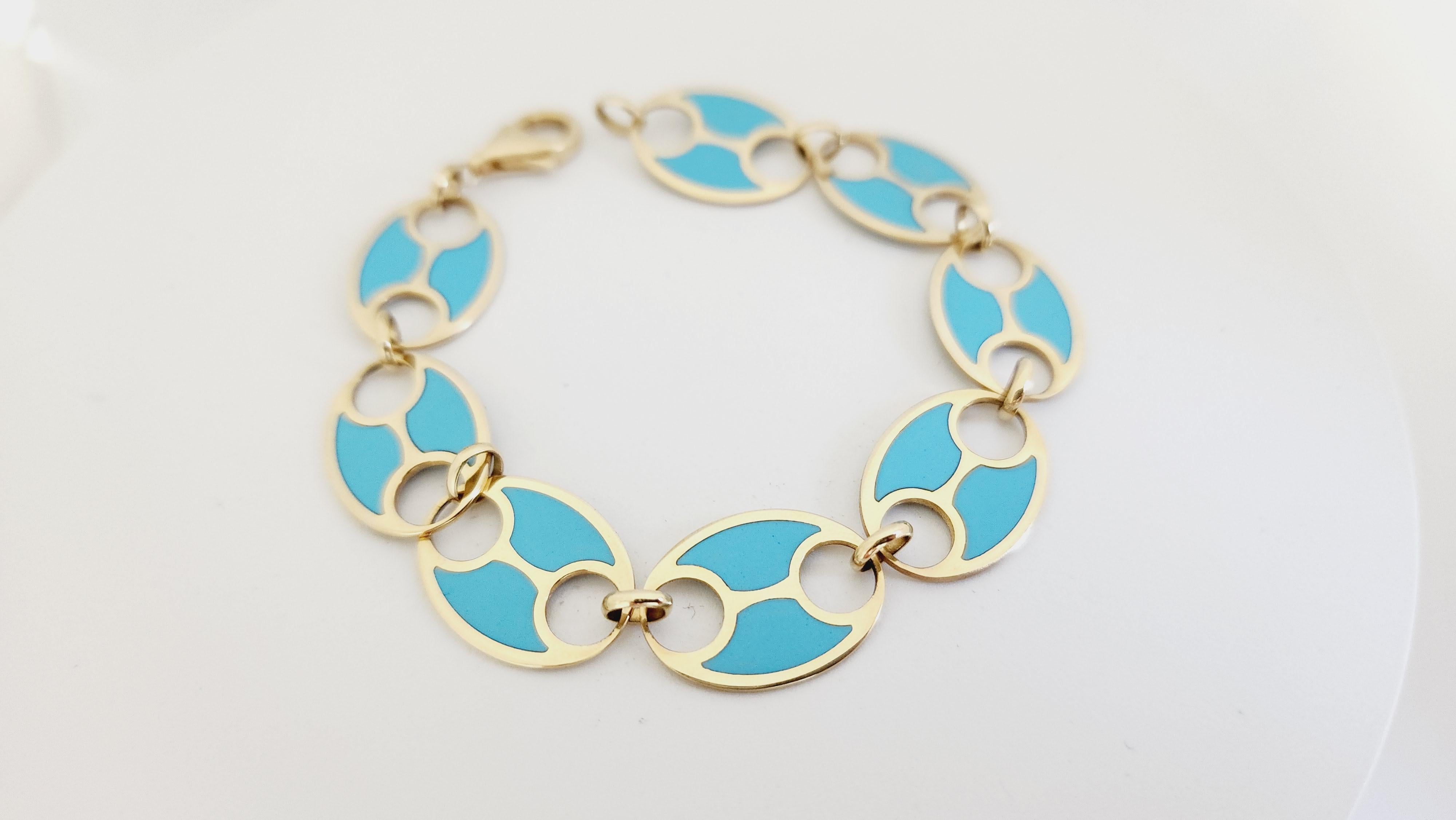 Turquoise Yellow Gold Link Bracelet, Lobster closure. Length is 7 inches.