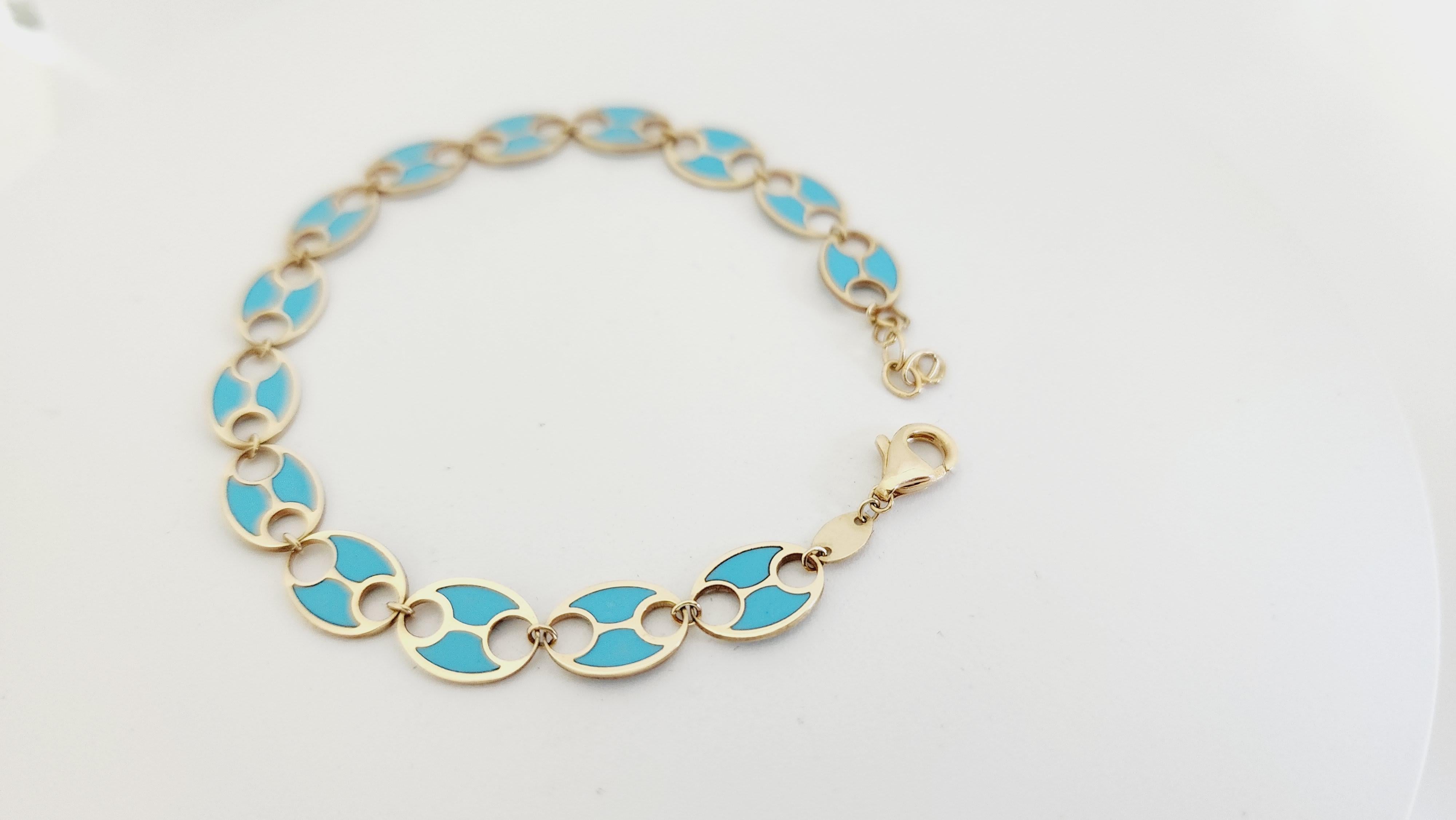 Turquoise Yellow Gold Link Bracelet, Lobster closure. Length is 7 inches.
