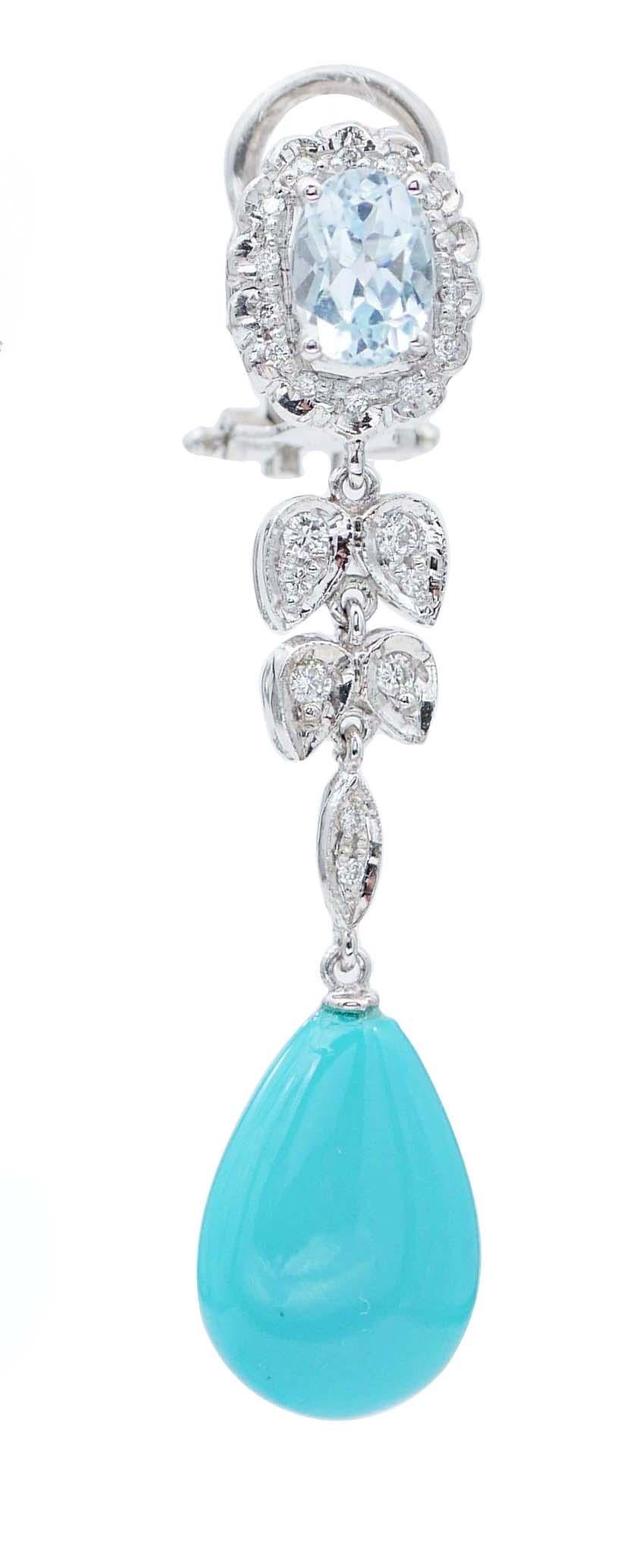 SHIPPING POLICY: 
No additional costs will be added to this order. 
Shipping costs will be totally covered by the seller (customs duties included).

Elegant dangle earrings in platinum structure mounted with an aquamarine surrounded by diamonds; in