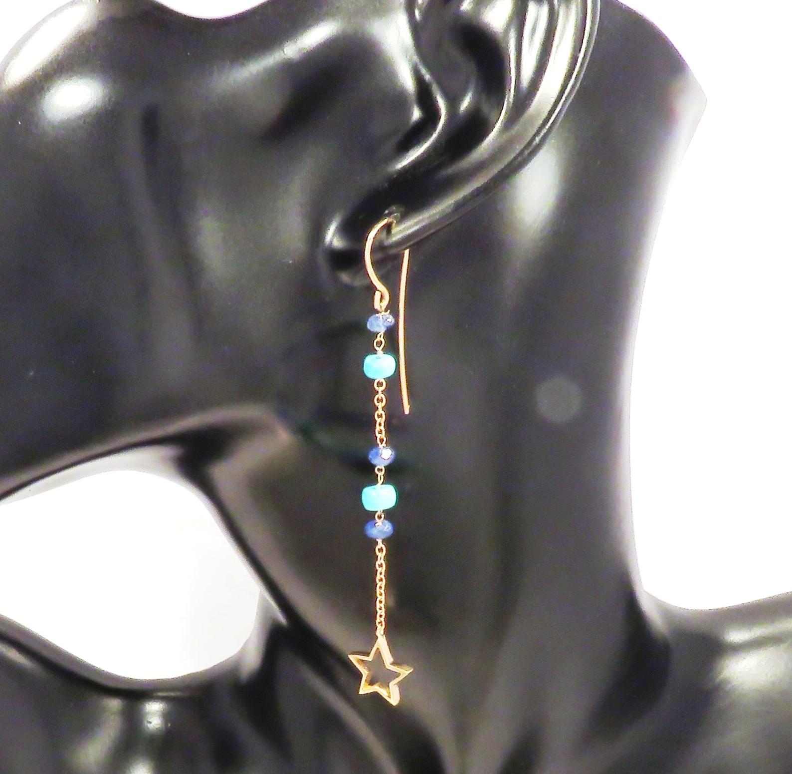 Dangle earrings with natural sapphires and genuine blue turquoises featuring a star charm. Each earring is handcrafted in 9 karat rose gold with 4 nugget cut sapphires and 3 nugget cut turquoises. This pair of earrings has different length: one