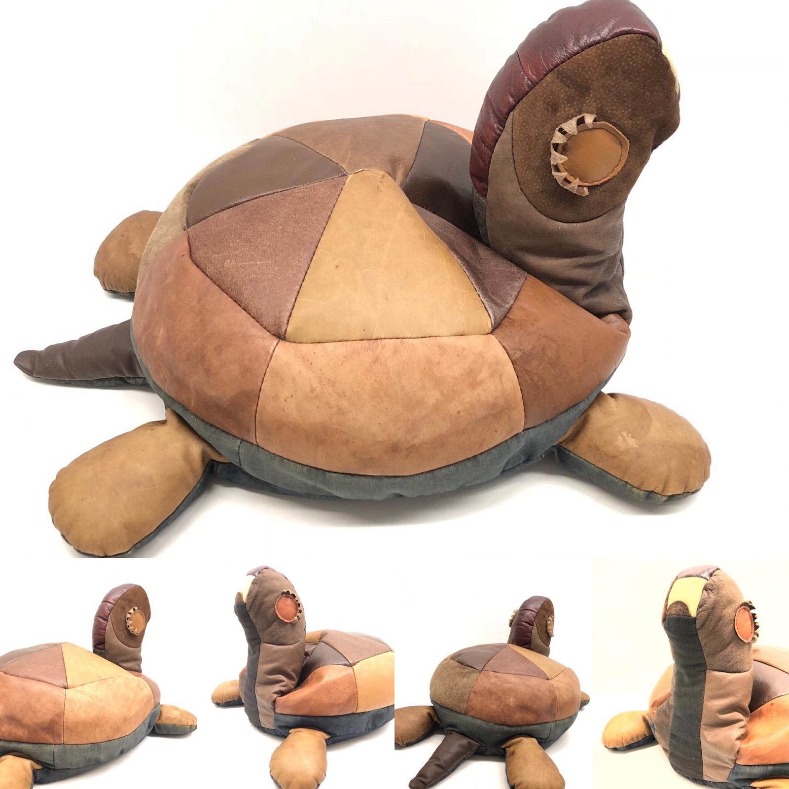 Tan brown leather handmade footstool poof ottoman in the form of a Turtle. The leather poof with a nice patina, gives your living room a beautiful style.