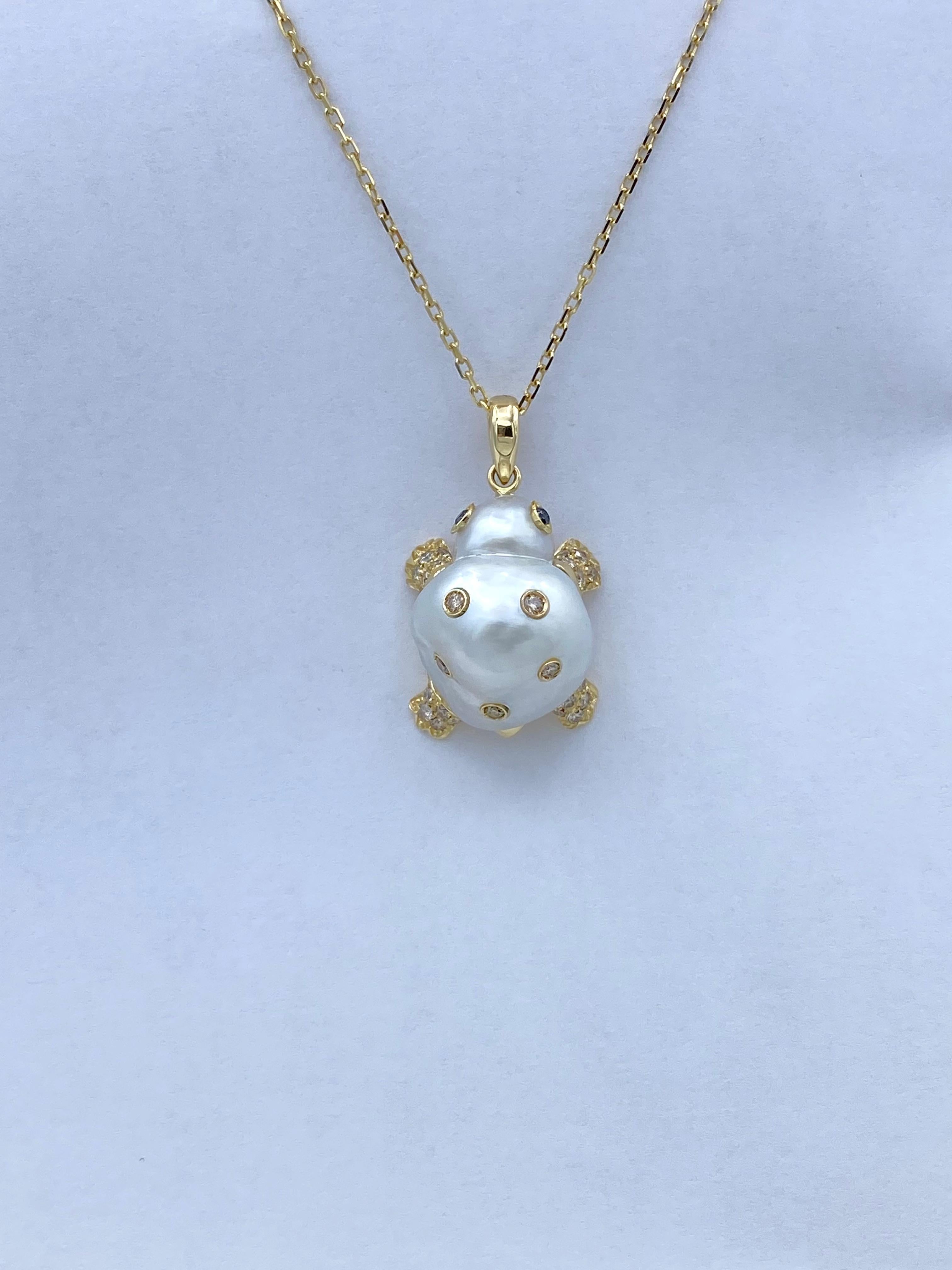 Turtle Brown Black Diamond 18Kt Gold Pendant/Necklace or Charm Handmade in Italy

I created this pendant using a 20x16mm Australian baroque pearl, which reminded me of a tortoise shell and its head. So I made the legs and the tail and I added the