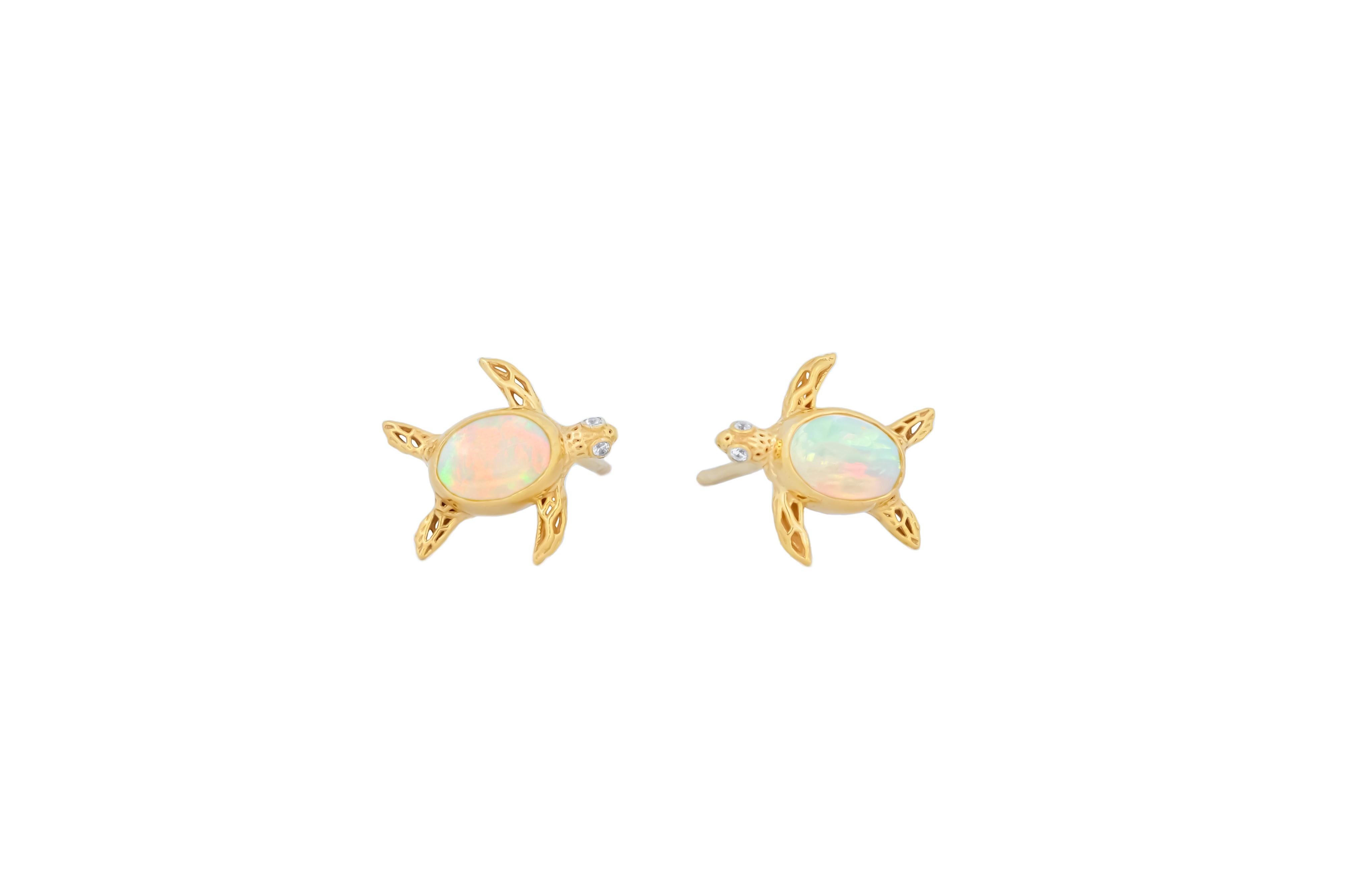 Modern Turtle earrings studs with opals in 14k gold.