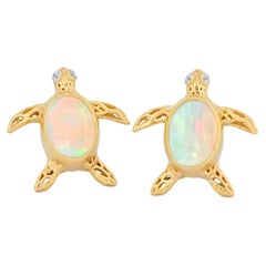 Vintage Turtle earrings studs with opals in 14k gold.