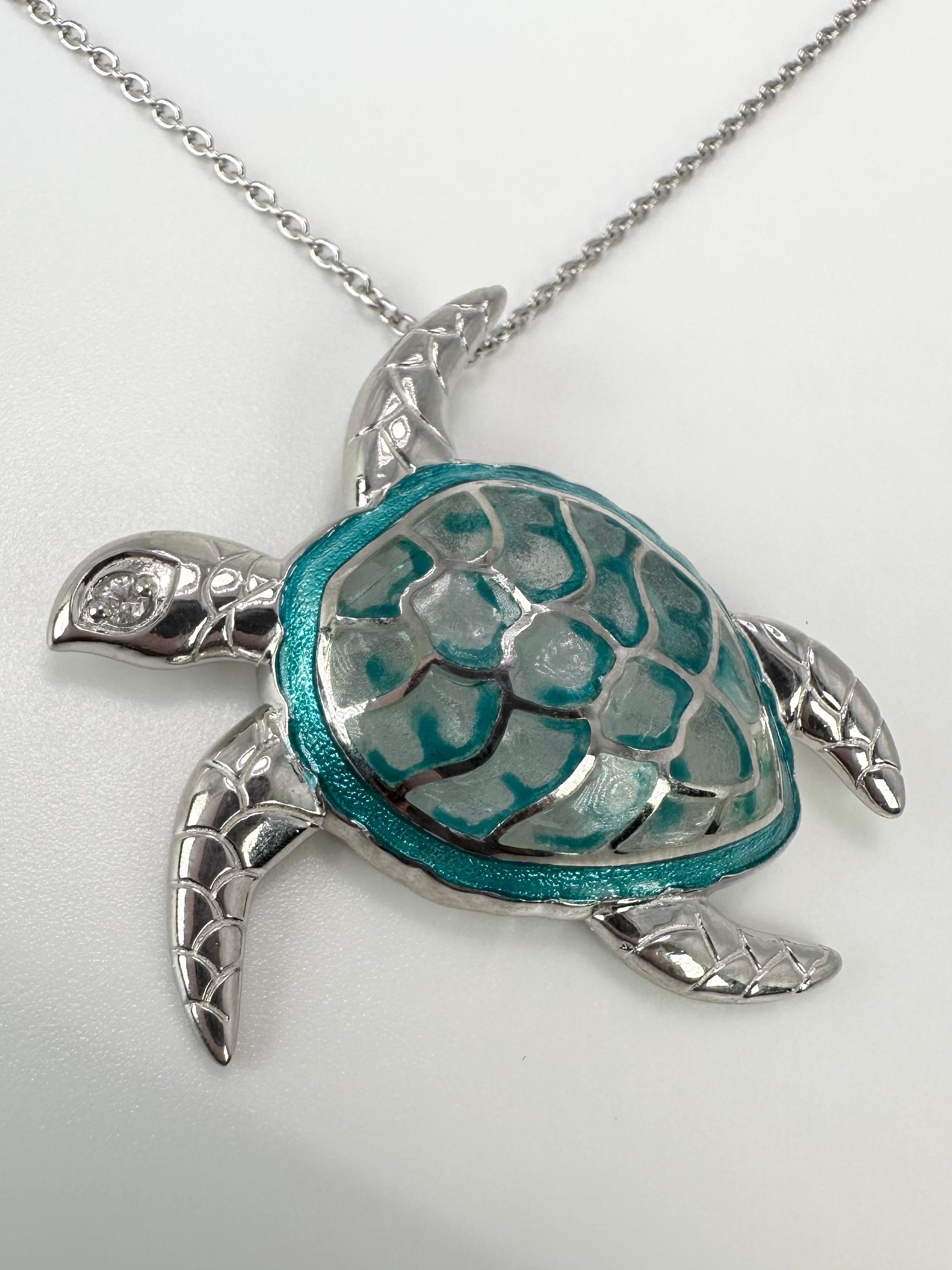 Glass enamel in a unique presentation and design, using array of colors that will neve fade. Natural diamond on the eye of thre turtle!
METAL: silver 925
Grams:13
Item: 64000019mkk
Chain included

WHAT YOU GET AT STAMPAR JEWELERS:
Stampar Jewelers,