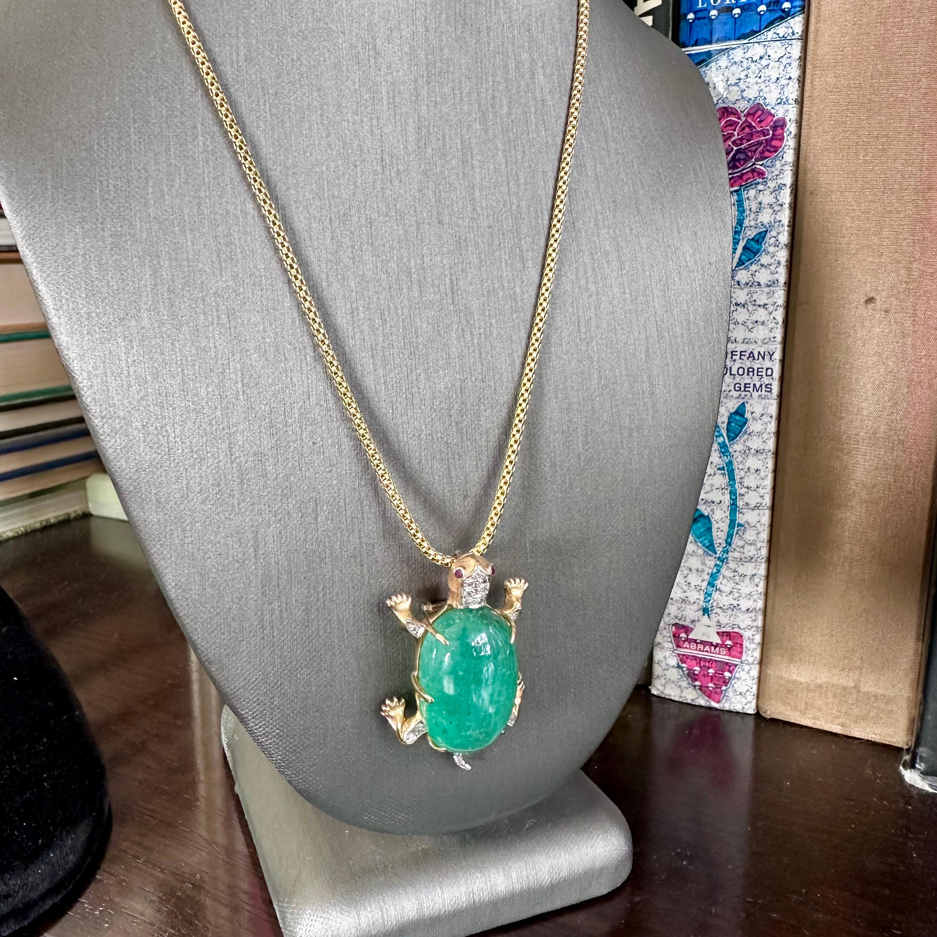 1950's Large 14k Turtle With A Massive 50 ct Cabochon Green Emerald 
Cabochon Emerald 
Dimensions: 30 mm 18mm 13.1 mm     EST 50 CTS
The body of the turtle is set with diamonds on each leg and his tail. The diamonds are set in either white gold or