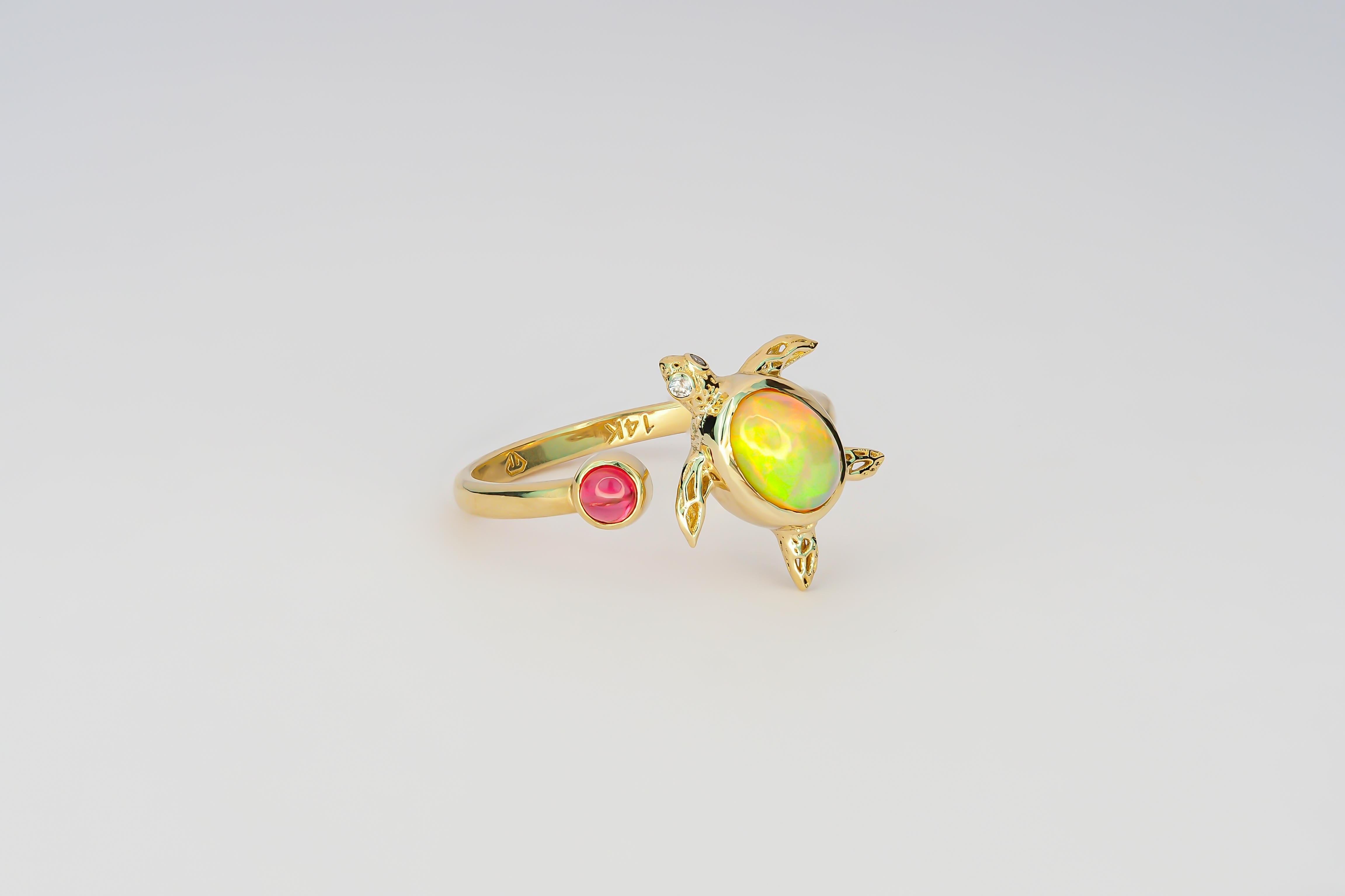 Turtle set: earrings studs and ring with opals in 14k gold. 
Opal oval cabochon earrings and ring in 14k gold.

Earrings:
Metal: 14k gold
Weight: 2.20 g. 
Size:  12.6 x8 mm
Main stone opal, solid , 2 pieces
Opal: color - multicolor
Oval cabochon