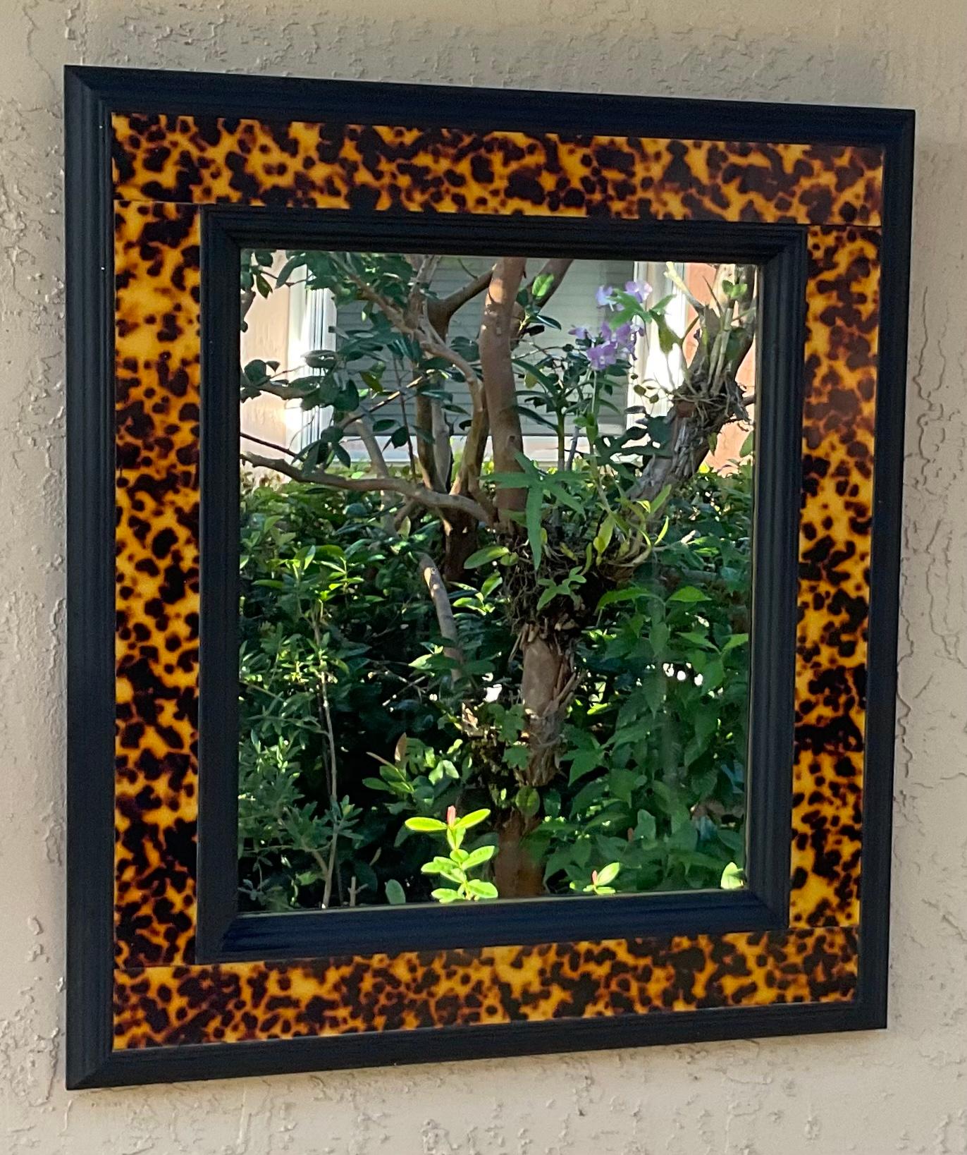 Beautiful mirror framed with decorative double solid wood frame and turtle shell Lucite faux border. 
Glass mirror size only: 16”x 20”.
