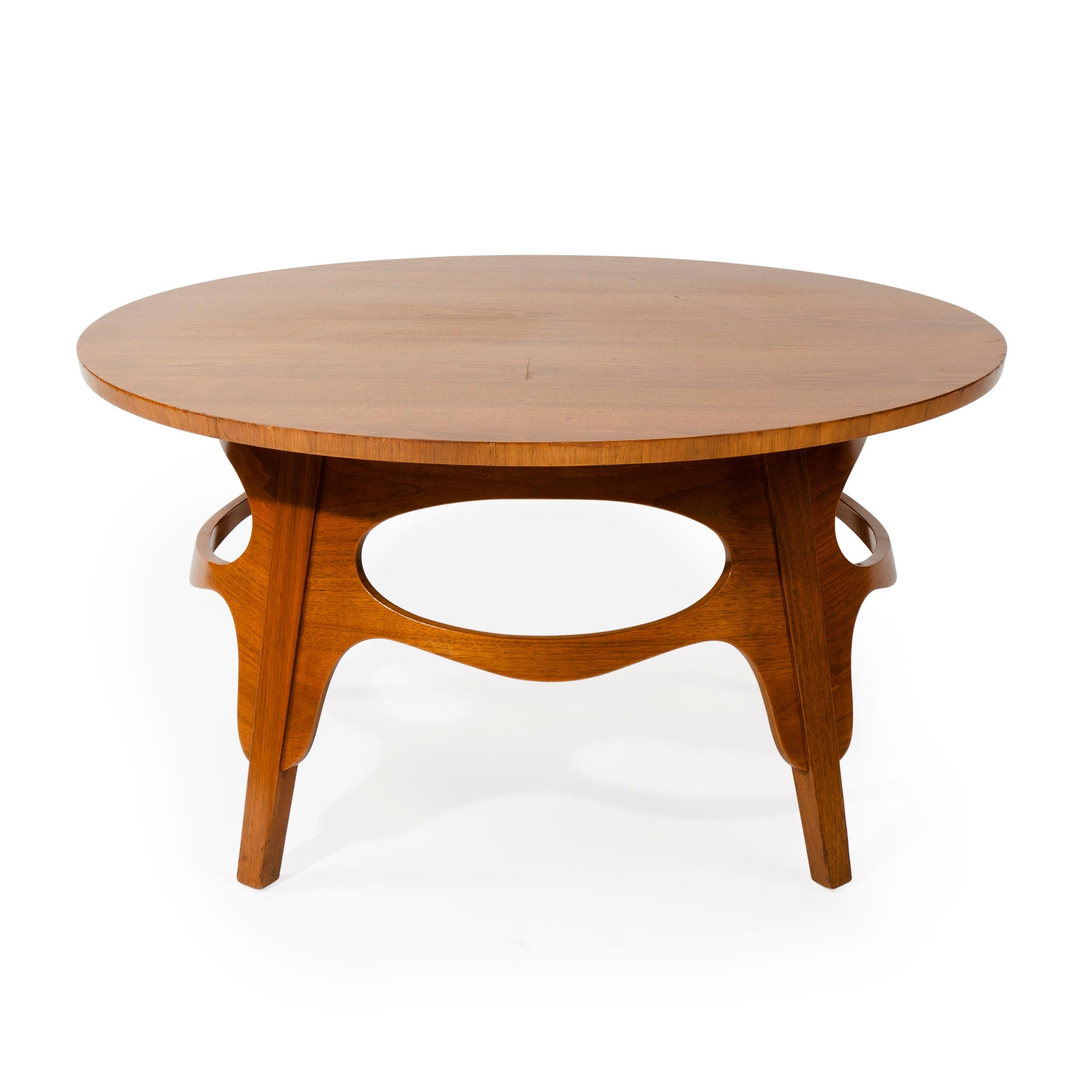 A 'Turtle' tea table with a Carpathian burled elm oval top on splayed, tapered walnut legs with fluid pierced-oval stretchers.