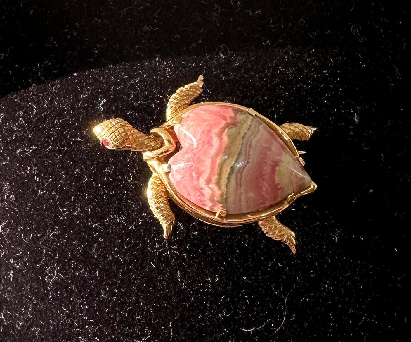 This is a wonderful antique Turtle or Tortoise Clip Brooch Pin with Ruby eyes and a fabulous heart shape Pink Rhodochrosite body in 14 Karat Yellow Gold in a gorgeous three dimensional design from the estate of Hollywood Legend Mary Lou Daves.  Ms.
