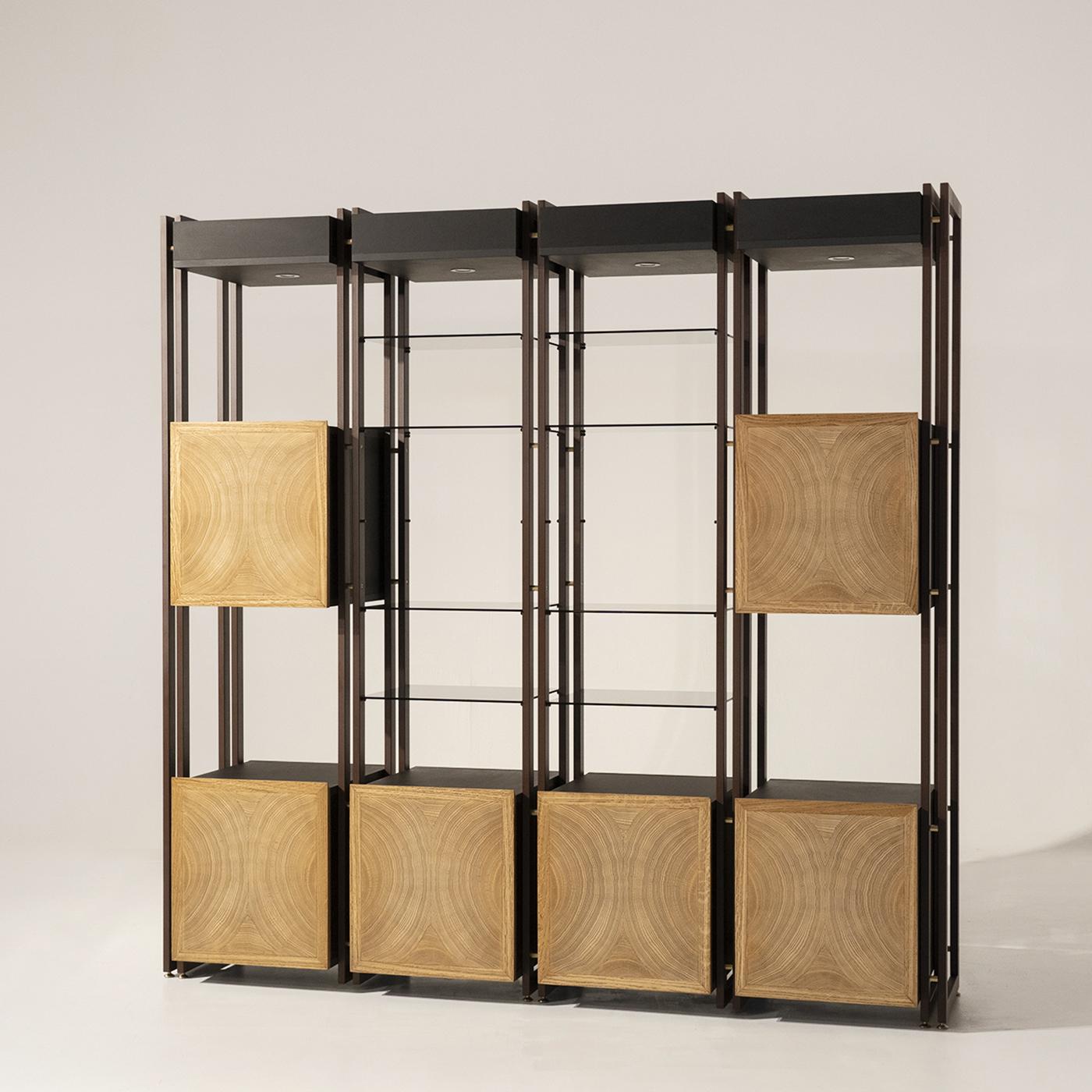 The Tury custom modular bookcase features a clean and linear design and an innovative veneer. The iron corten structure connects via satin brass spacers and the recurring feature within the Tury line is the decorative motif on the doors derived from
