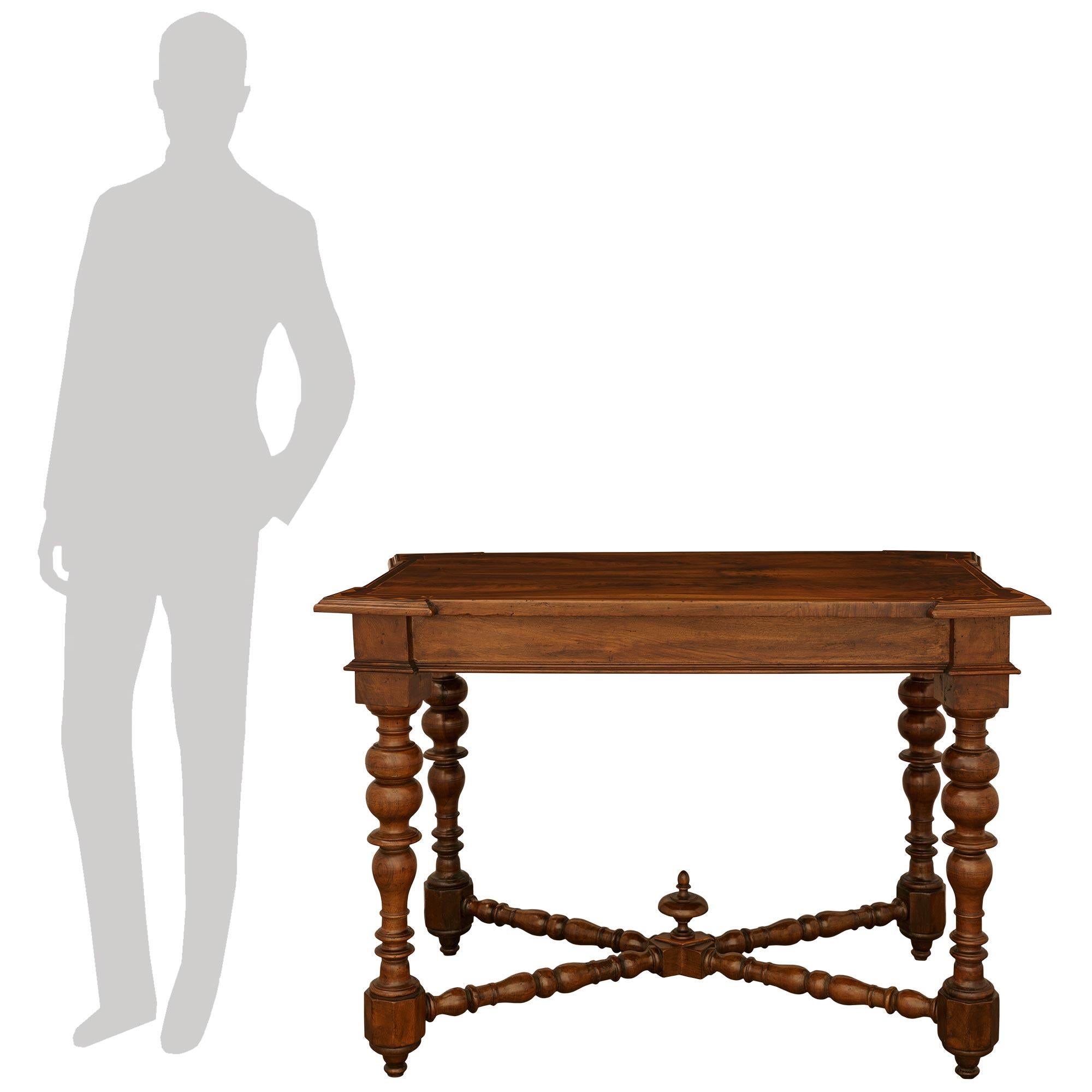 A handsome and high quality pair of Tuscan 17th century Walnut, Mahogany and Fruitwood side tables, from Lucca. Each wonderful table is raised by toupie shaped feet below the most decorative turned legs, which are connected by an X shaped stretcher