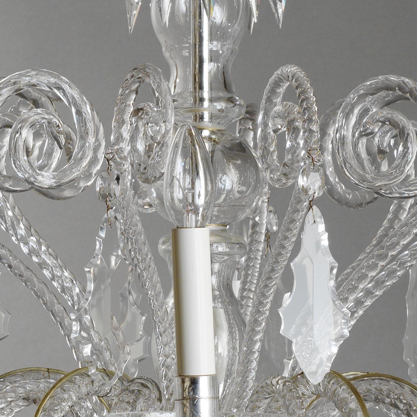 Elegant Italian Rococò Style Chandelier by Gherardo Degli Albizzi made by blown glass, in transparent color with silvered cups , composed by ten arms in the middle part of the chandelier. Both the top crown and the lower cup hold plenty of pastorals