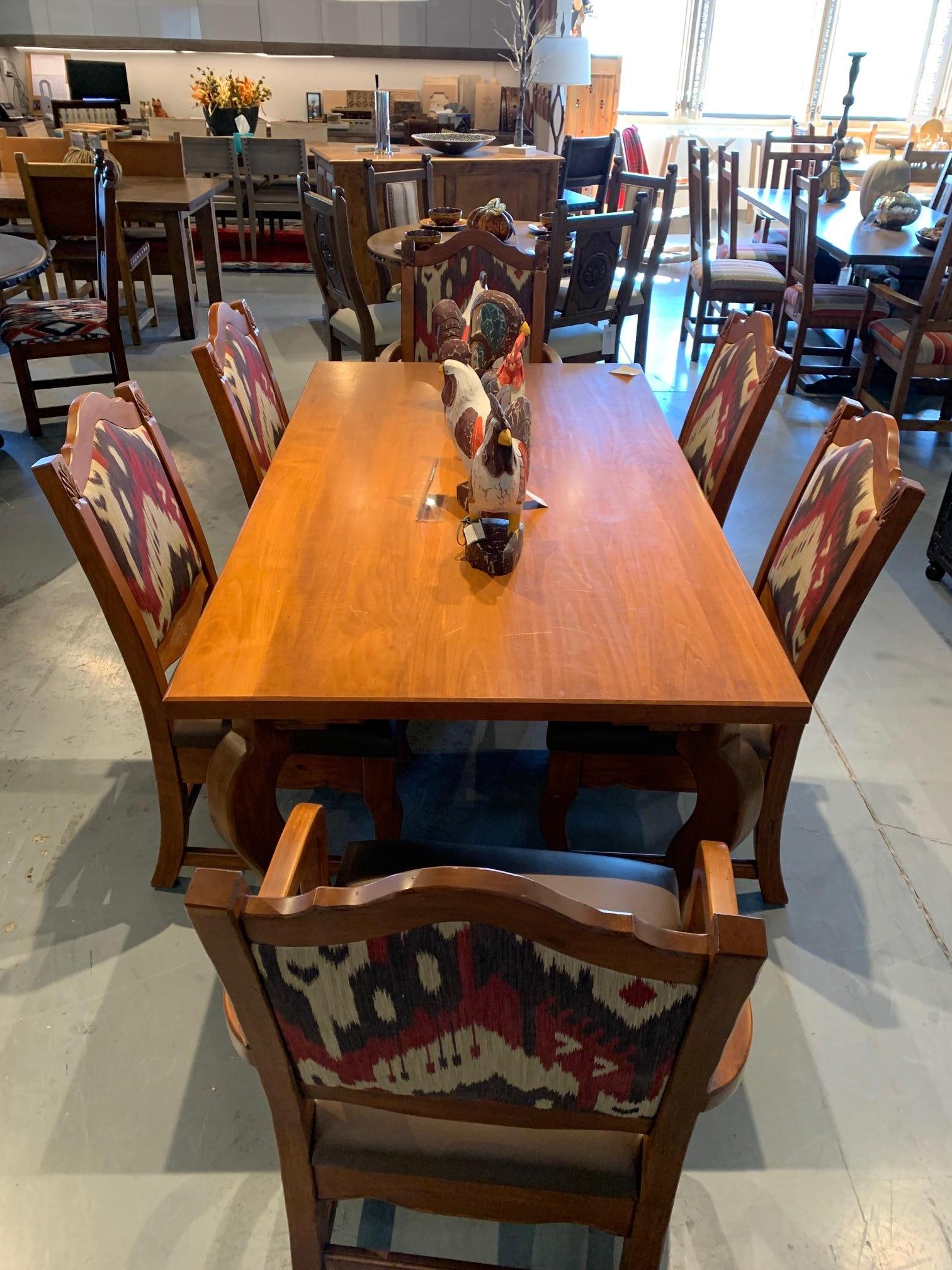 Tuscan Dining Arm Chairs with carving and fully upholstered.
Dining Table and Side Chairs (as shown in photos and listed separately) are available on our storefront as well. Table and chairs are not a matching set.

These are showroom floor models