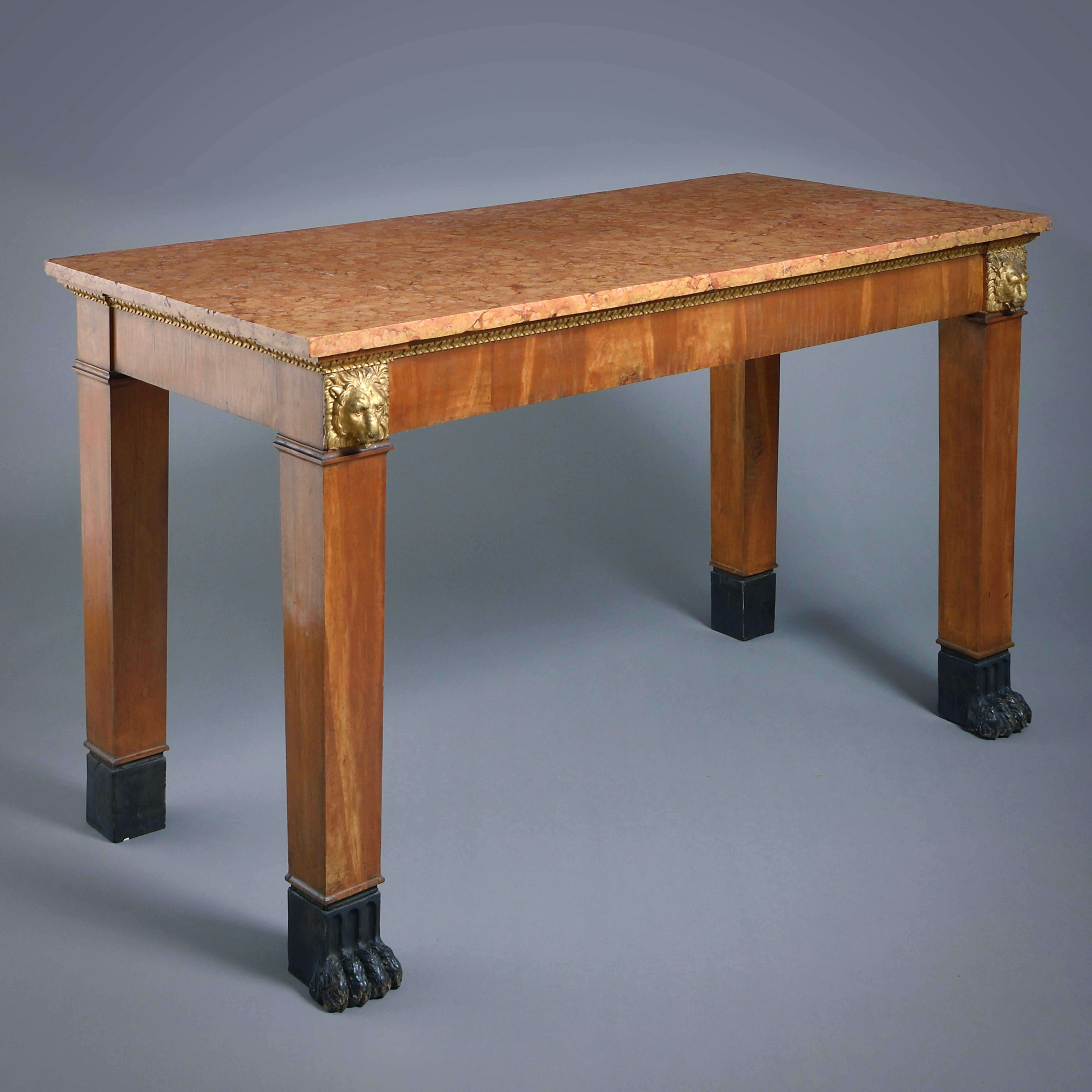 A Tuscan parcel-gilt fruitwood side table, circa 1800.

With original Rosso di Verona marble top. Original decoration.