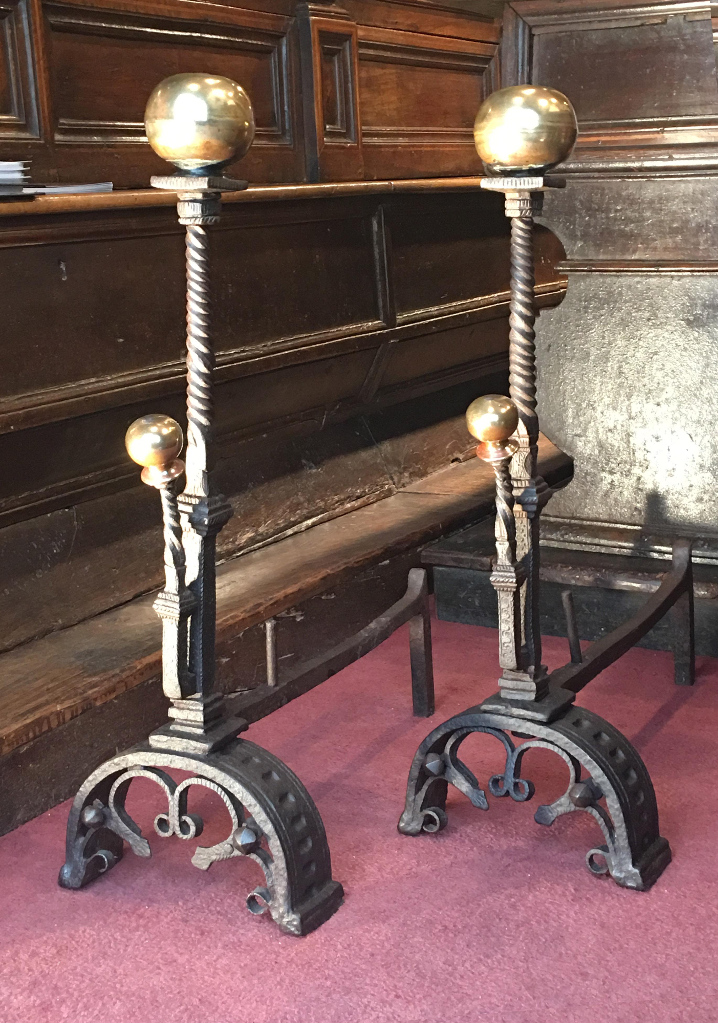 Origin: Italy, Florence

Wrought iron and bronze

A very rare pair of bronze andirons.

The base shows a grooved arcature with a decor of stylized fleur-de-lys. The square shaft is linked to the twisted upper part through a finely carved