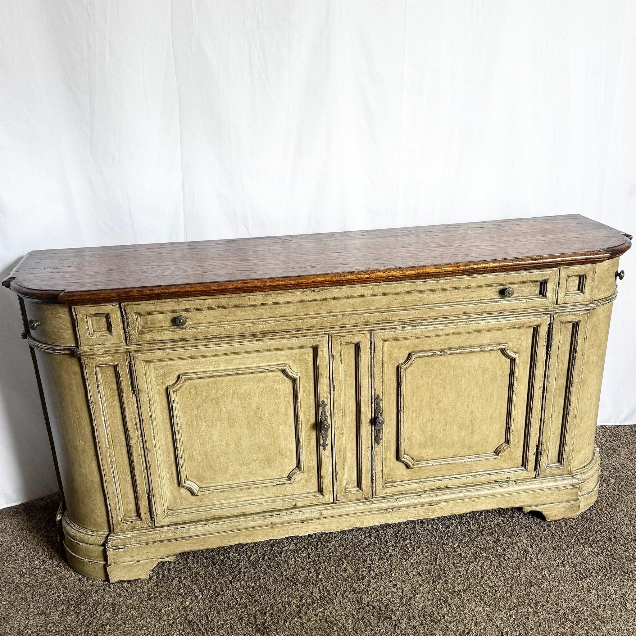 Tuscan Reproduction Walnut Sideboard—gracefully curved silhouette with paneled doors and antique-style hardware exudes Italian countryside elegance.
 
 We sell items as acquired, without restoring or repairing. Vintage pieces may have age-related