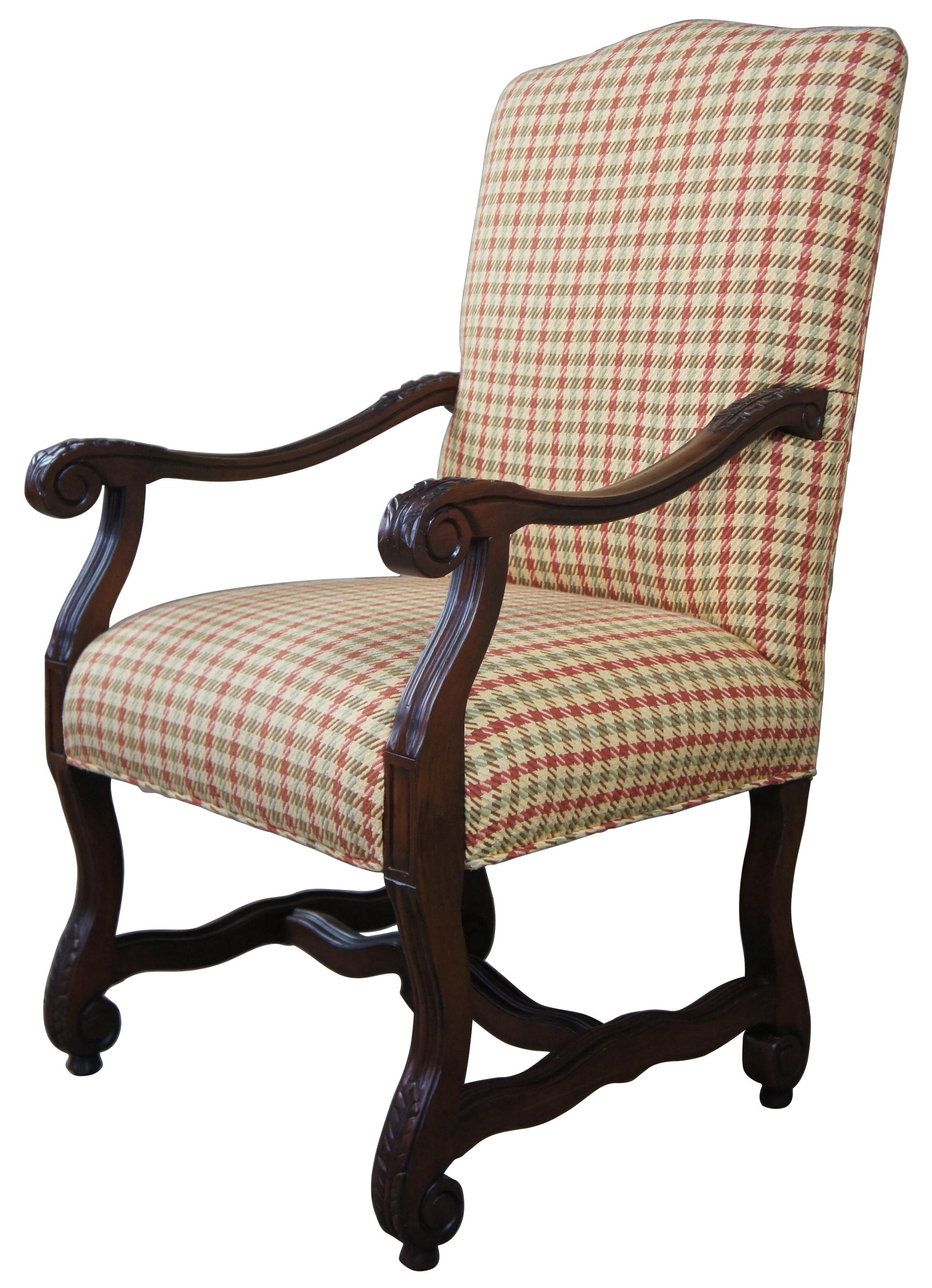Old world Tuscan style armchair with scrolled arms and legs. Features acanthus leaf carvings and a serpentine trestle base. Great for use in the library or living area. 
 