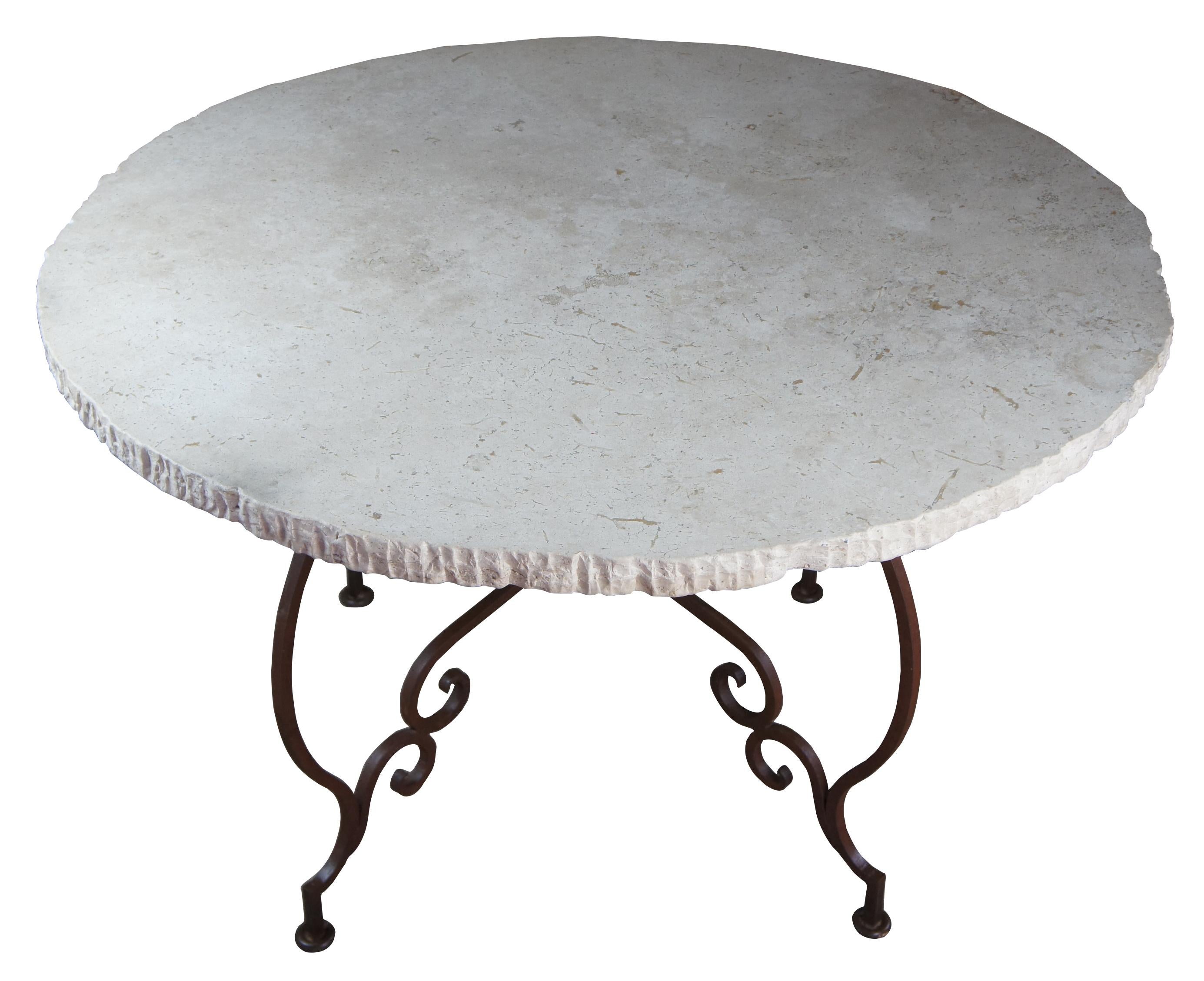 Tuscan style scrolled iron center table with stone top French entryway pedestal

French or Tuscan inspired center or dining / breakfast table. Features a scrolled iron base and round stone top with round scalloped edge.