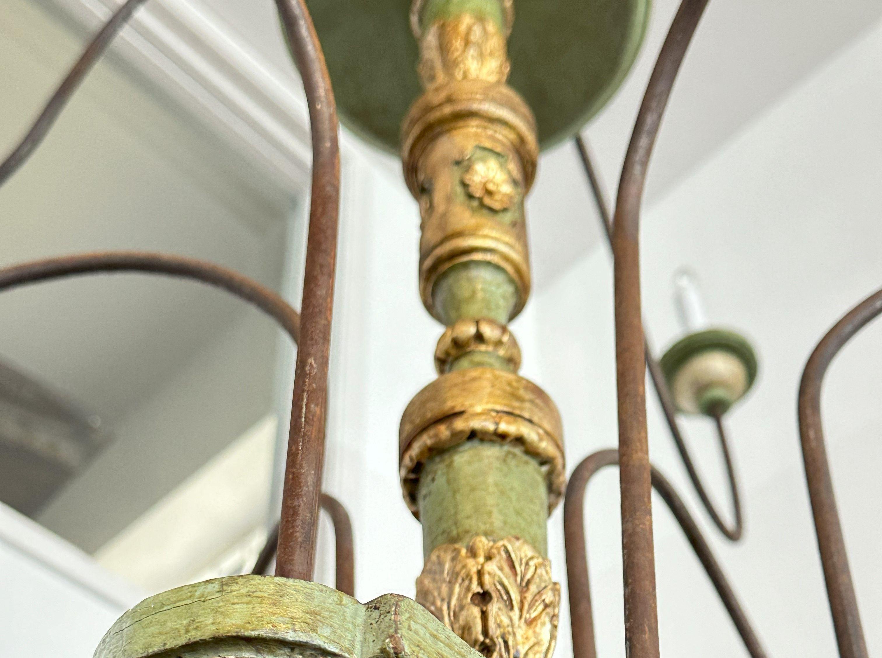 Tuscan chandelier composed of 19th century and later elements , baluster standard issuing ten tole scrolling arms