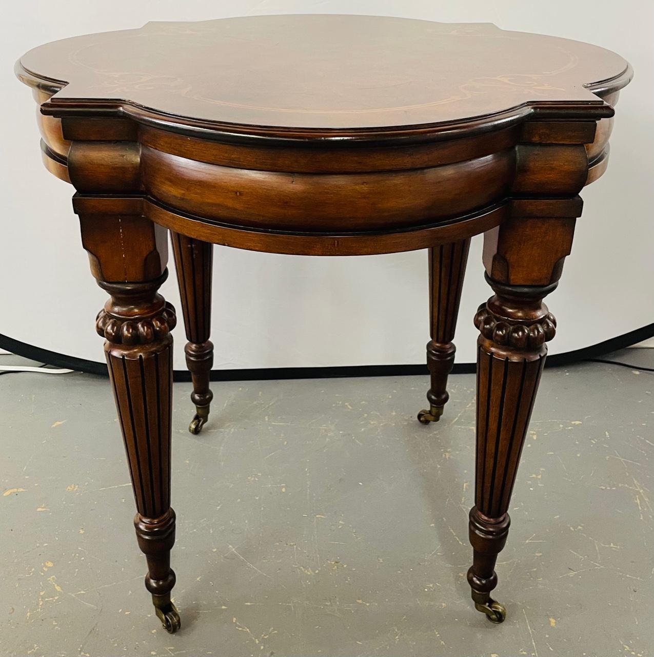 Made of birch and zebrano wood, this high quality Ethan Allen Tuscany marquetry end table or side table with amazing inlay design on the top and standing on four finely carved legs with aprons and standing on casters to easily move around your