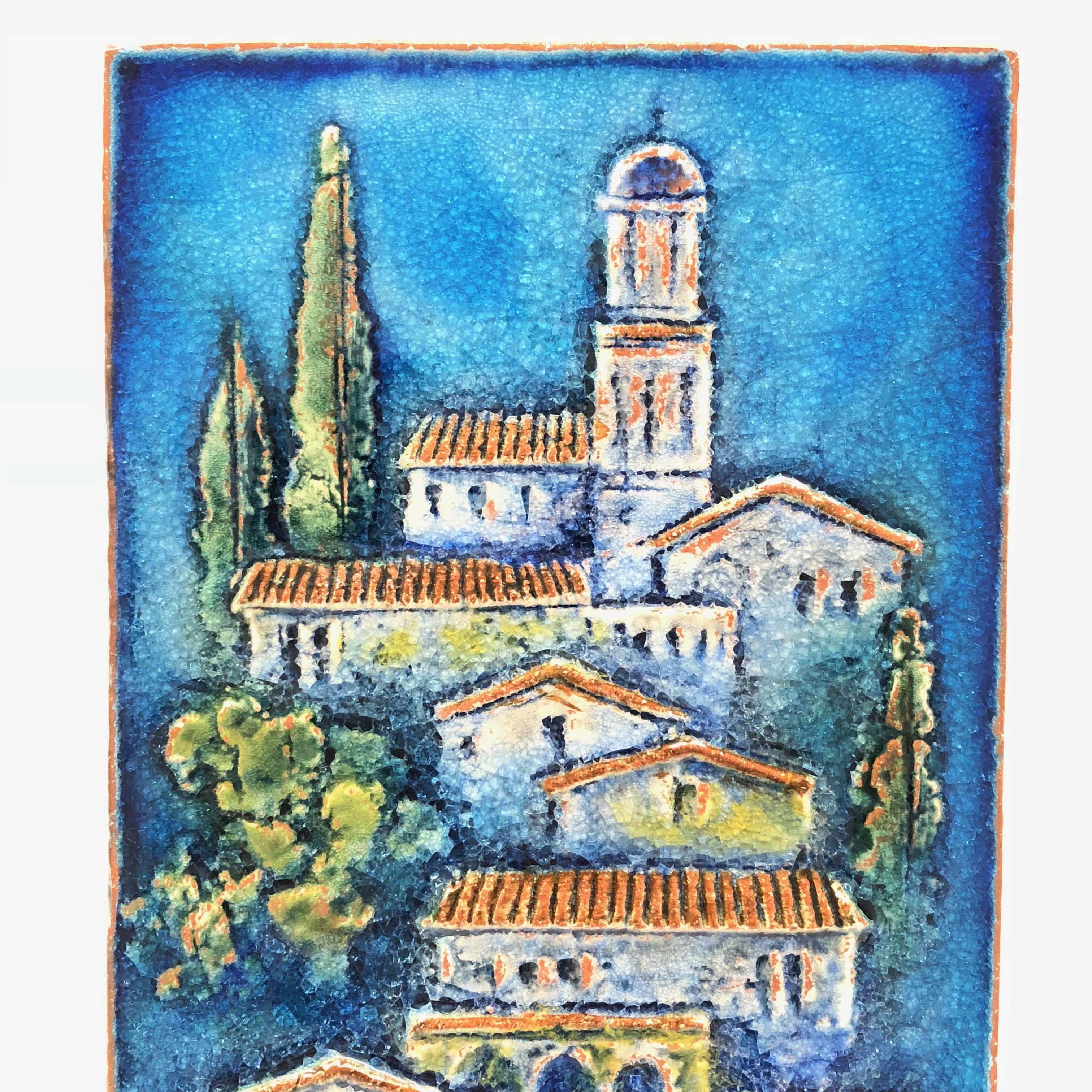 A beautiful, German glazed terra cotta or Majolica landscape tile by Karlsruhe, circa 1970. This gorgeous wall art depicts a Tuscany Village. Well detailed and beautiful colors.